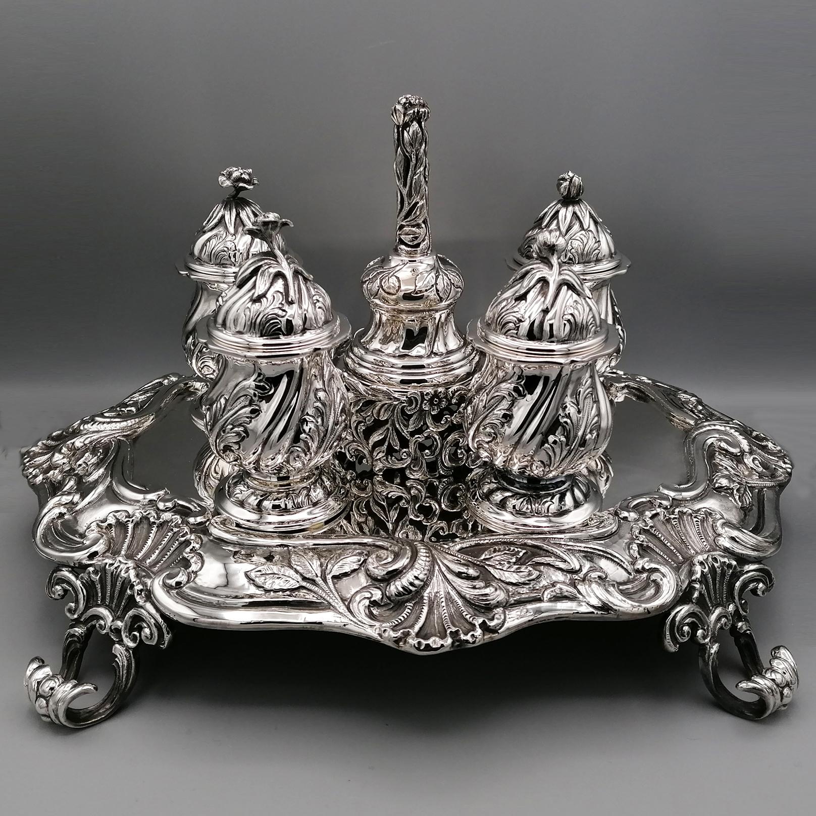Faithful copy of the writing service by the silversmith Pietro Rubini, Milan c.1775
The inkstand is composed of a shaped tray supported by 4 rocailles feet, modeled along the entire profile by finely embossed and chiselled volutes, leaves and