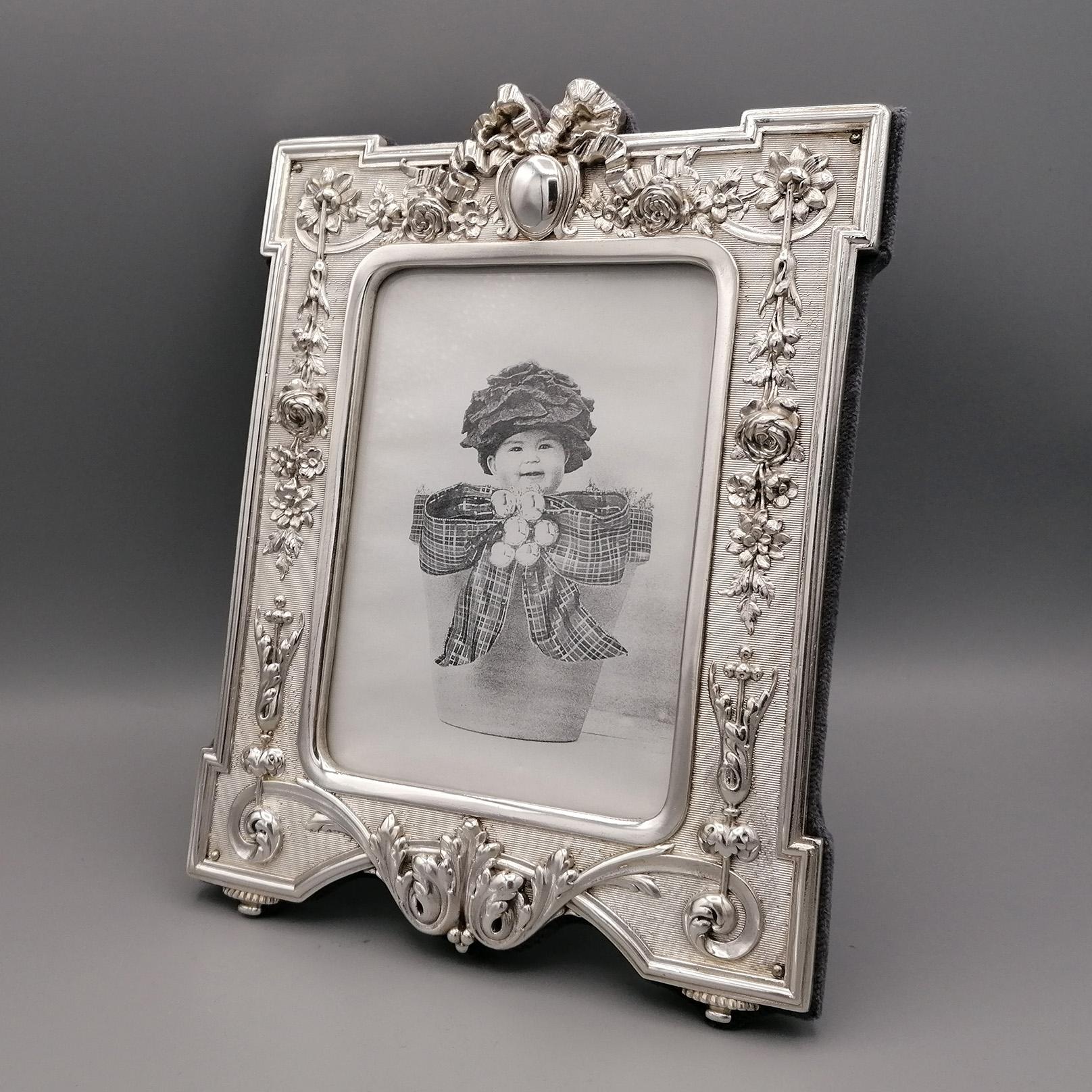Sterling silver photo frame.
The frame was made in Italy by the Argenteria Raddi of Florence.
The design is typically Libeerty with the characteristic flowers, festoons and ribbons.
The shaped frame was striped against the background of the