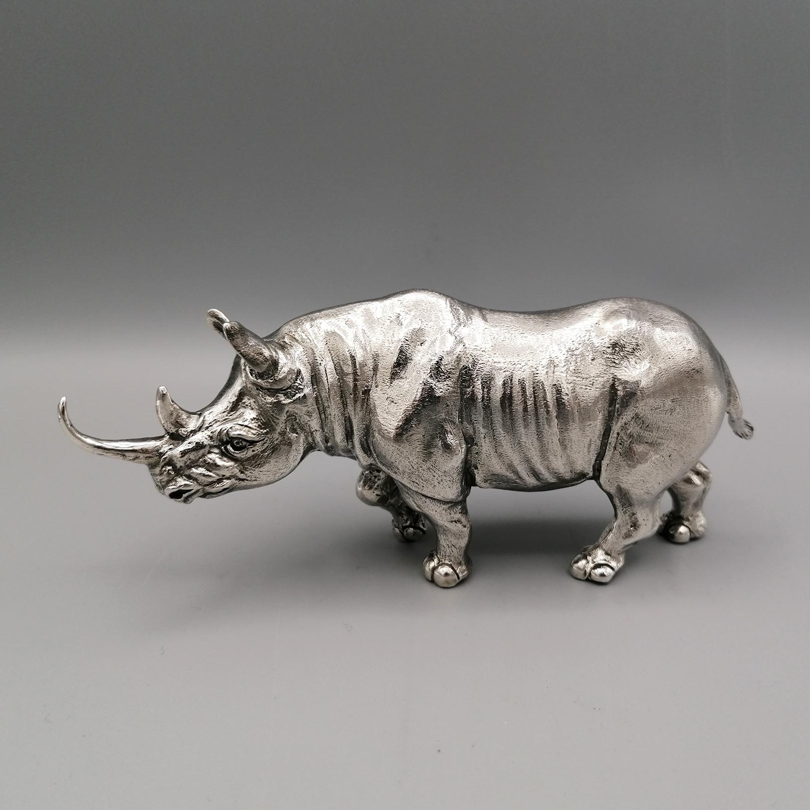 Solid 925 sterling silver rhino.
The sculpture was made with the casting technique and then finished completely by hand by expert chisellers to make the rhino's skin realistic and the whole sculpture as a whole.
   