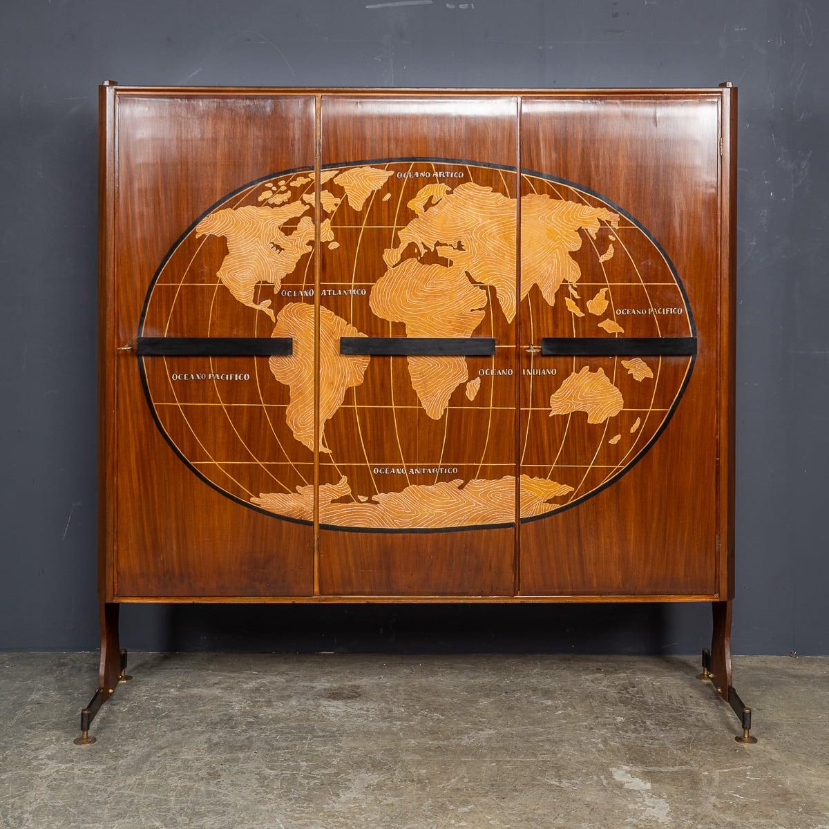 A superb 20th Century Italian three-door cabinet featuring a stylised world map on the front. The oceans are labelled in Italian, while the landmasses are adorned with a 