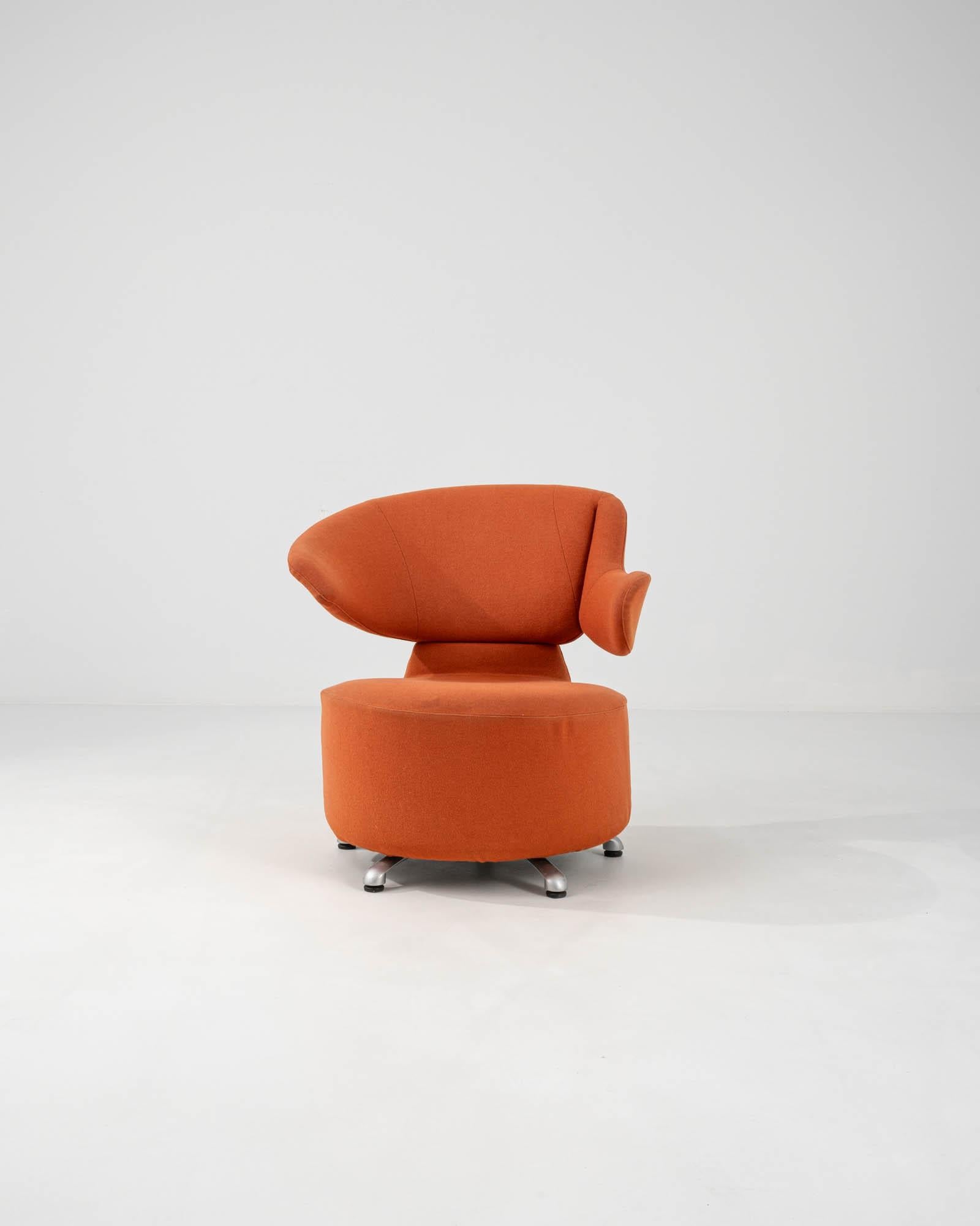 Embrace the fusion of Italian craftsmanship and innovative design with this 20th-century Italian swivel armchair by Cassina. Its bold terracotta upholstery radiates warmth and adds a pop of color to any interior. With a distinctive high back and