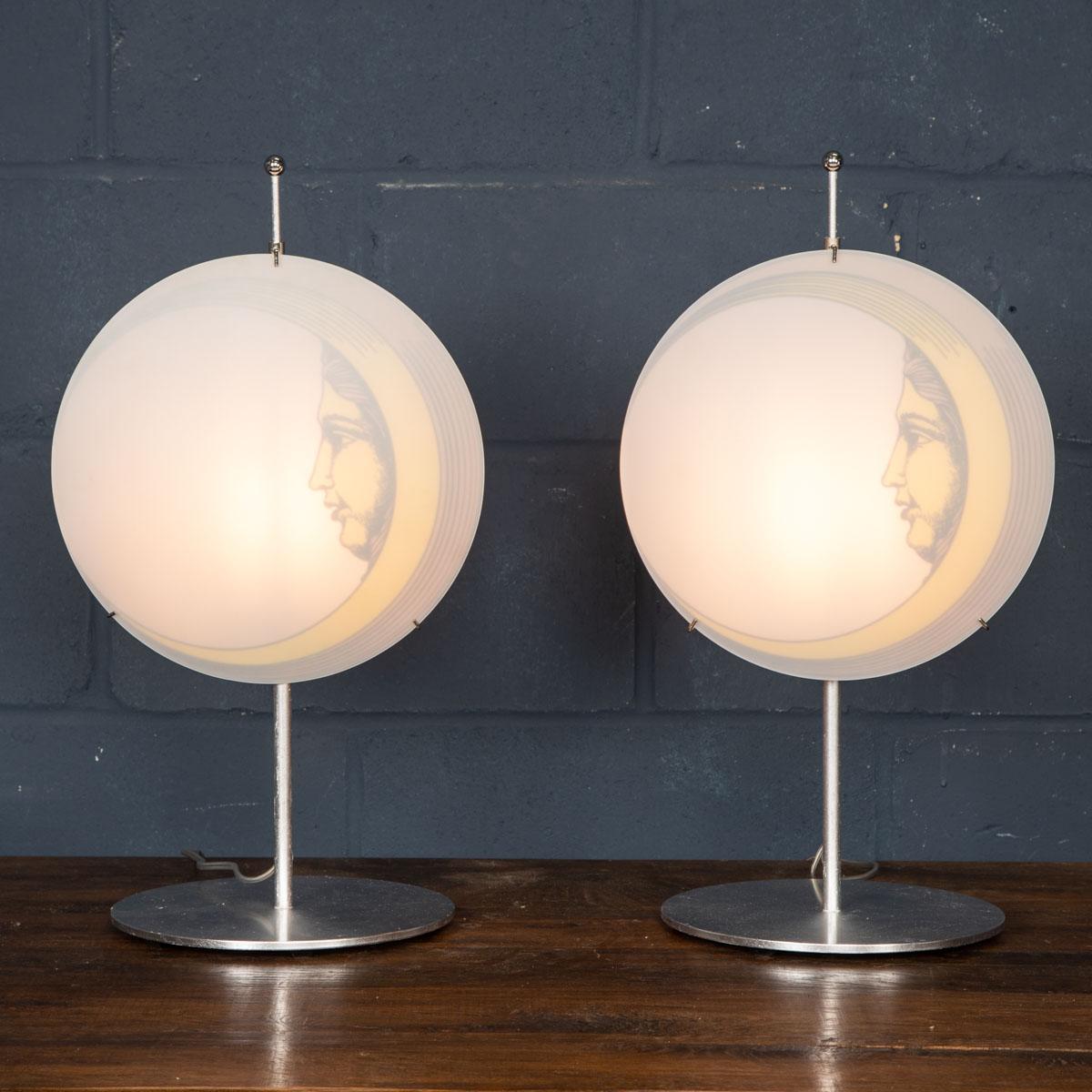 A beautiful pair of table lamps by Piero Fornasetti. This particular model retailed by Antonangeli in the 1990s, now discontinued and appreciating in value. More importantly it gives any room a very chic twist on lighting with its frame supporting a