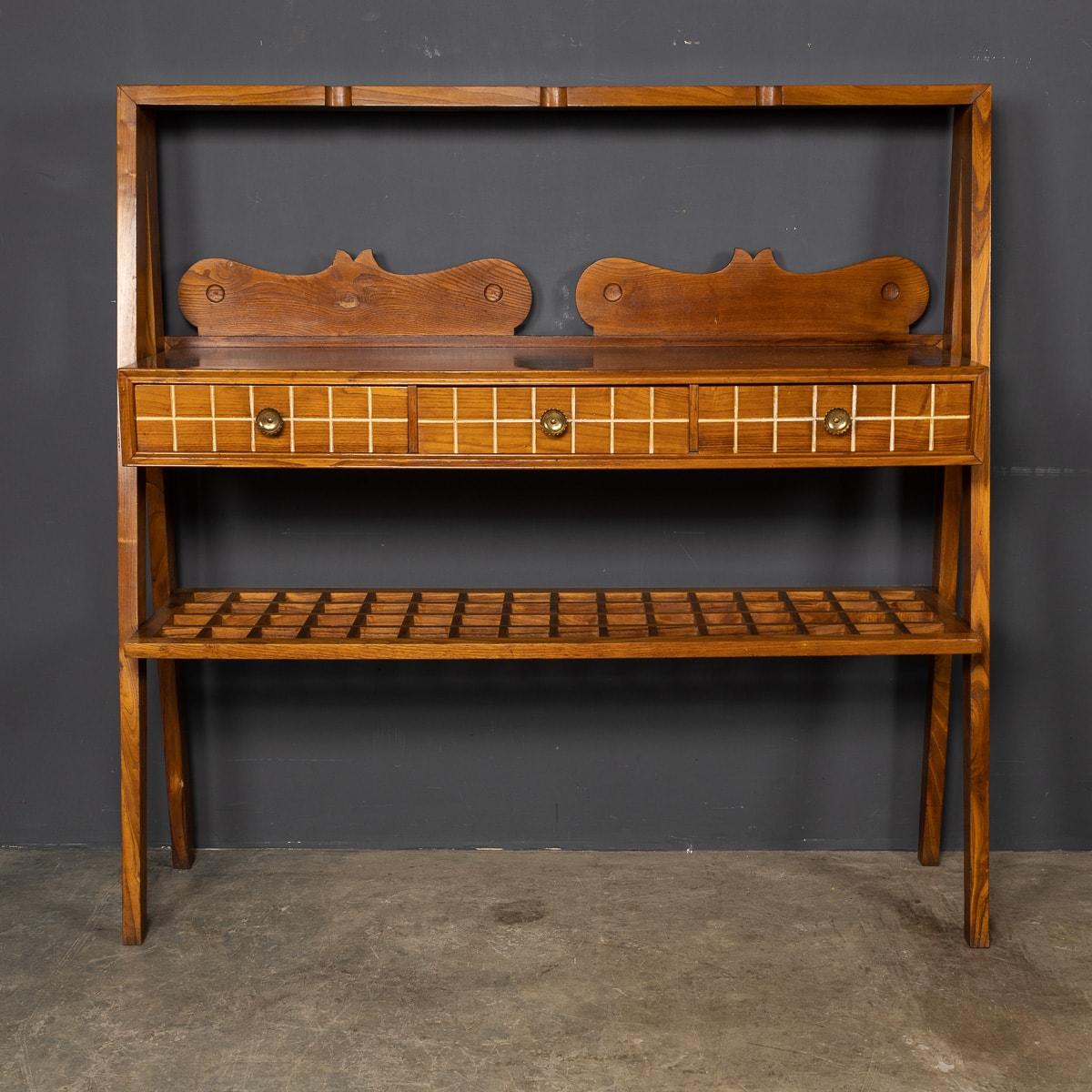 An unusual Mid-20th Century Italian three drawer dresser created from solid oak. This dresser was designed by Paulo Buffa, an Italian architect and designer who speciliased in traditional craftsmanship with a twist of modern design.