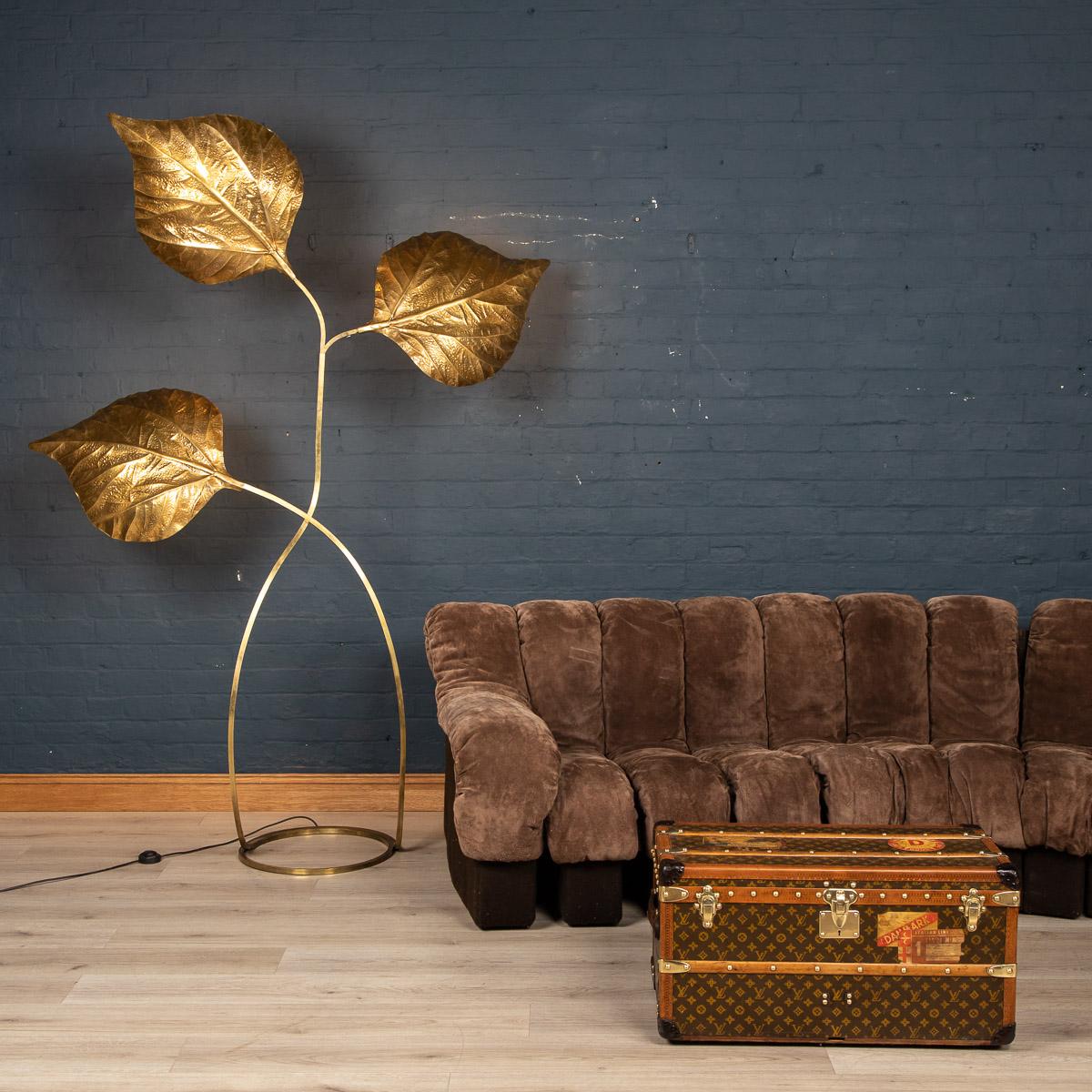 A wonderful 3 leaf floor lamp by Tommaso Barbi with attachments for 3 lights, the brass structure supporting pressed brass leaves. The length of each leaf can be adjusted slightly thanks to a telescopic thread at the base of each. Once lit it