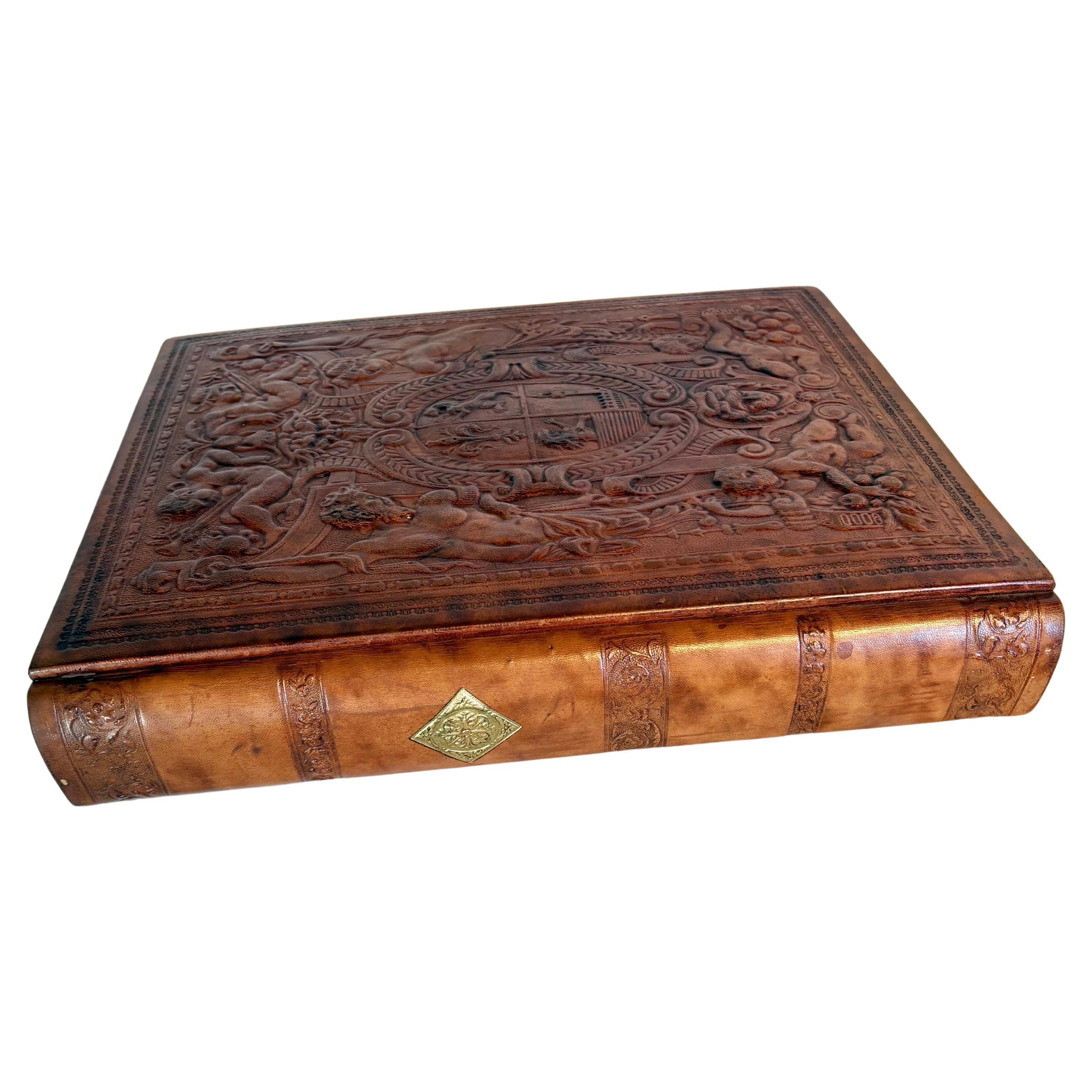 This 20th Century Italian Book was handcrafted in hand tooled leather in the 1900's. Produced in Italy for Cavallini and Company, this book features double sided blank pages of heavy stock cream paper that are separated by parchment pages. The