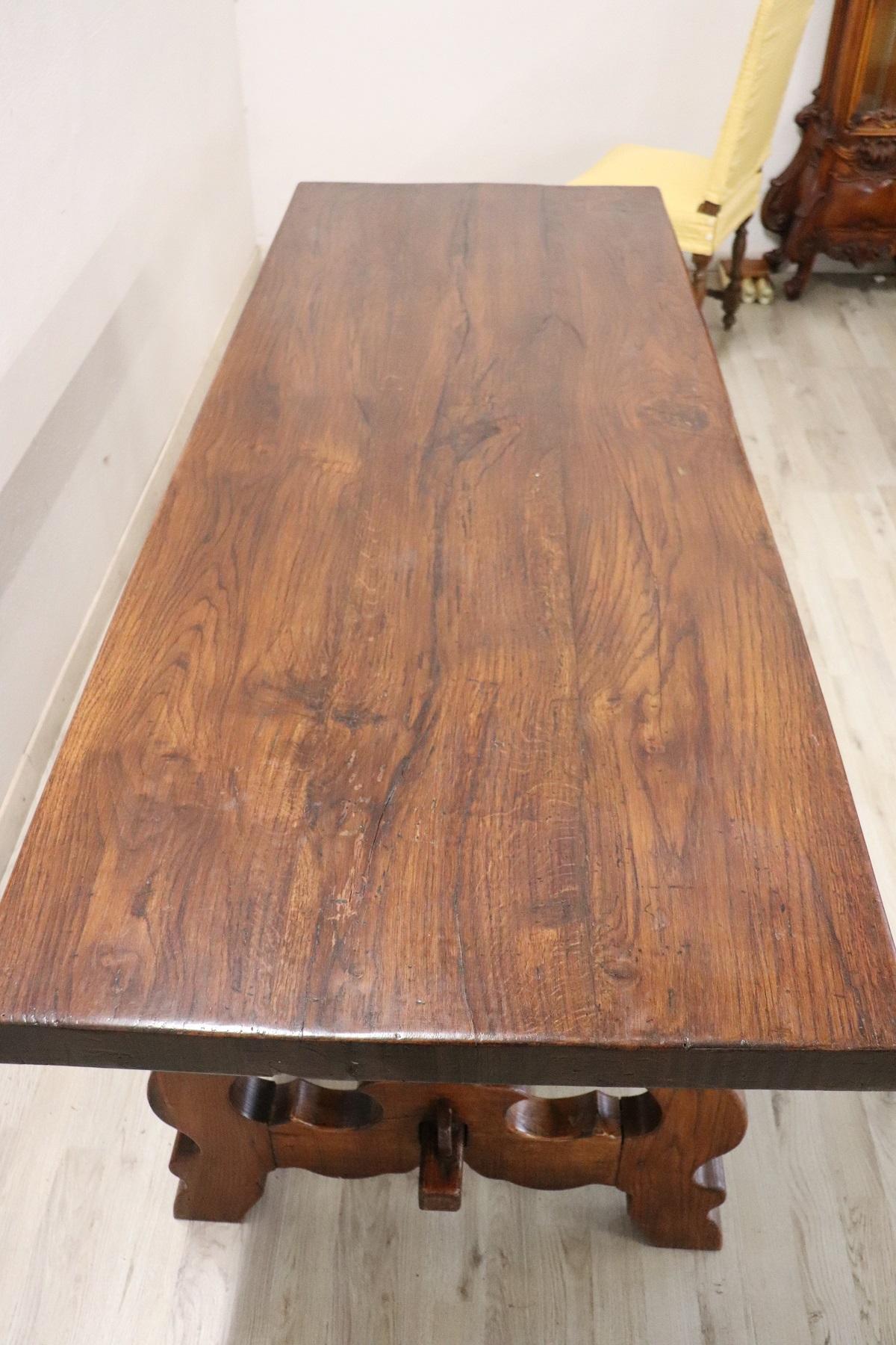 Large solid oakwood table from the mid-20th century. Oakwood has a beautiful patina. Particular lyre-shaped legs.
Perfect to be used for your dining room.