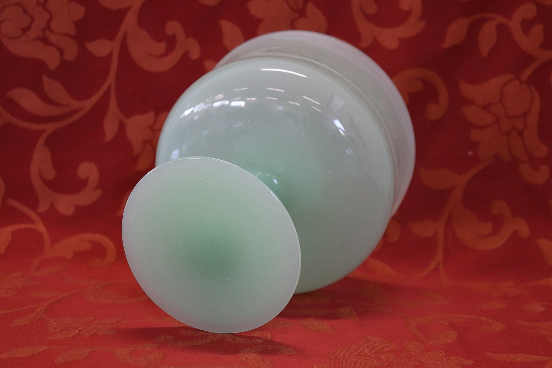 Refined artistic opal glass vase in green color, Italy, production circa 1980s probably Murano.
