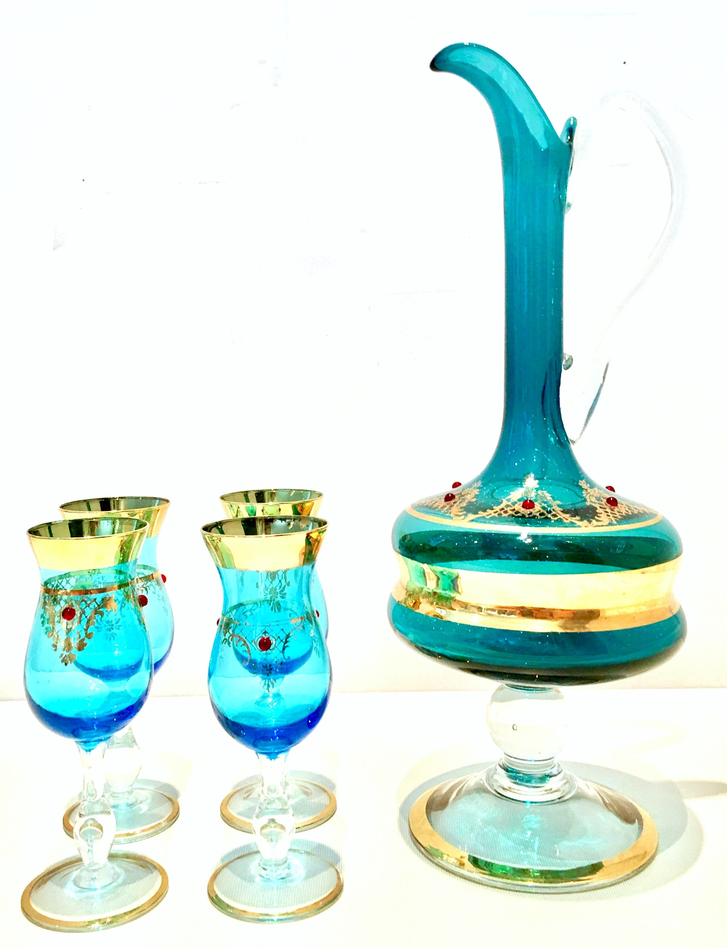 Midcentury Italian Venetian blown glass and 22-karat gold, crystal ruby jeweled drinks set of 5 pieces. This lovely handmade drinks set features a vivid blue ground with 22-karat gold Hand-painted detail and ruby red crystal rhinestone detail. Set