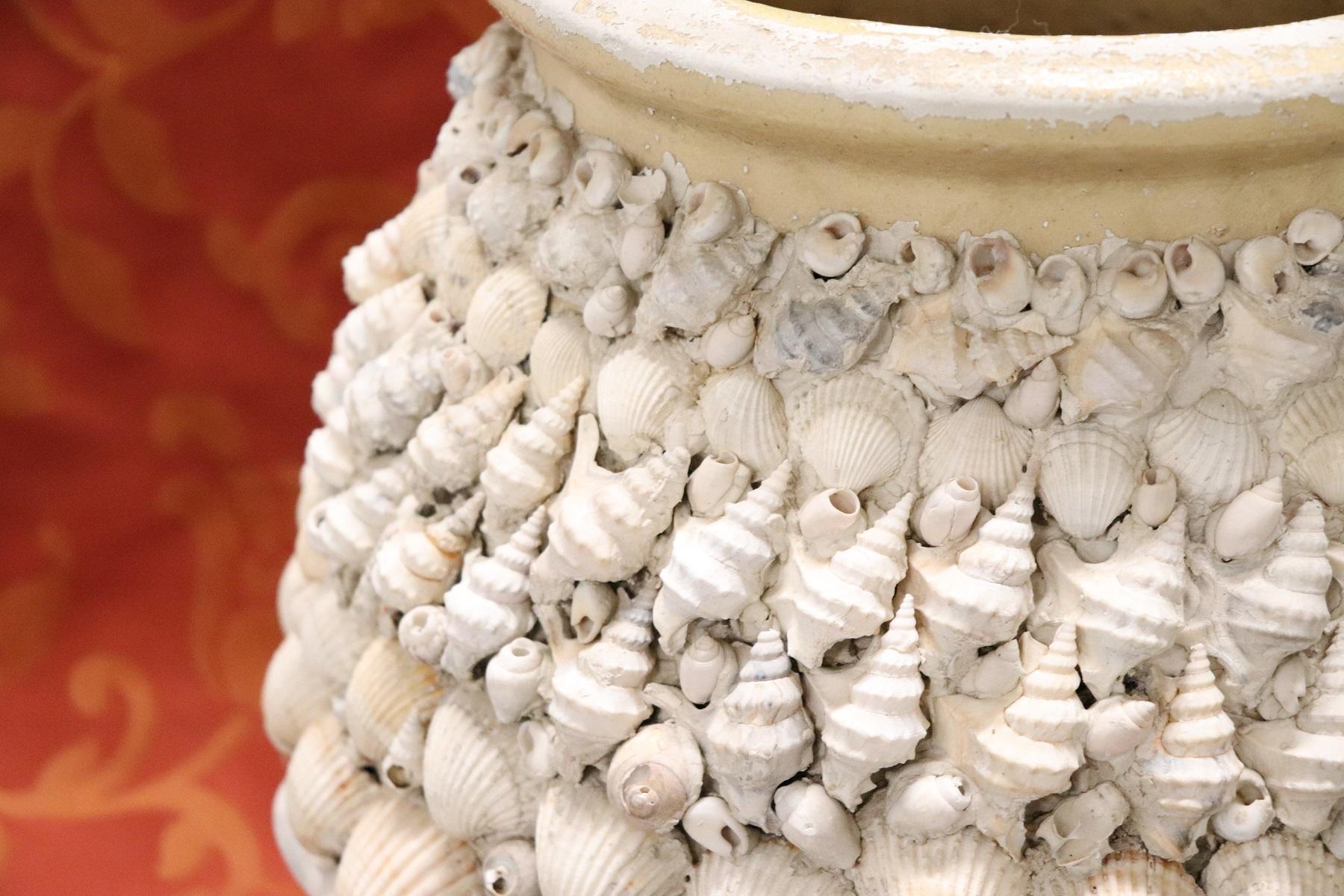Beautiful artistic ceramic vase completely covered in real shells. Italian craftsmanship. Particular furnishing ideal for your houses by the sea.
Used two small deficiencies visible in photos.
