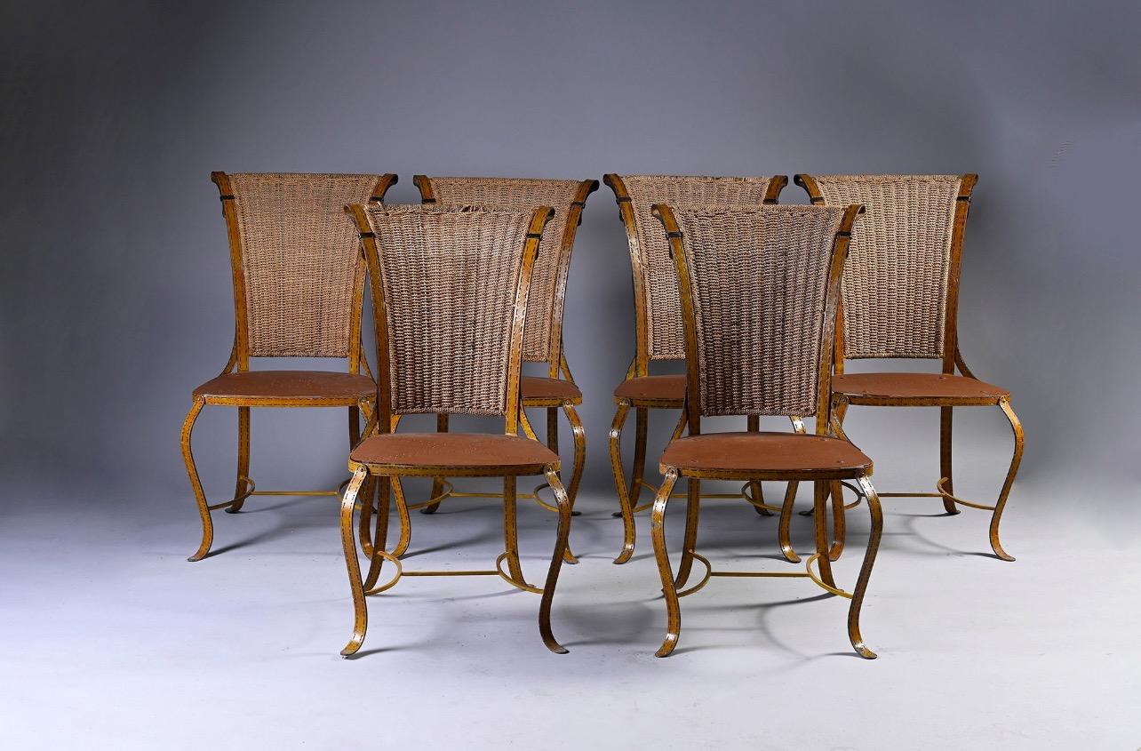 20th Century Italian vintage hand made metal chairs looking as made of  leather horse tack straps with rope backs. Six chairs available in very good authentic condition with no restorations ever made.
Italy, circa 1960
