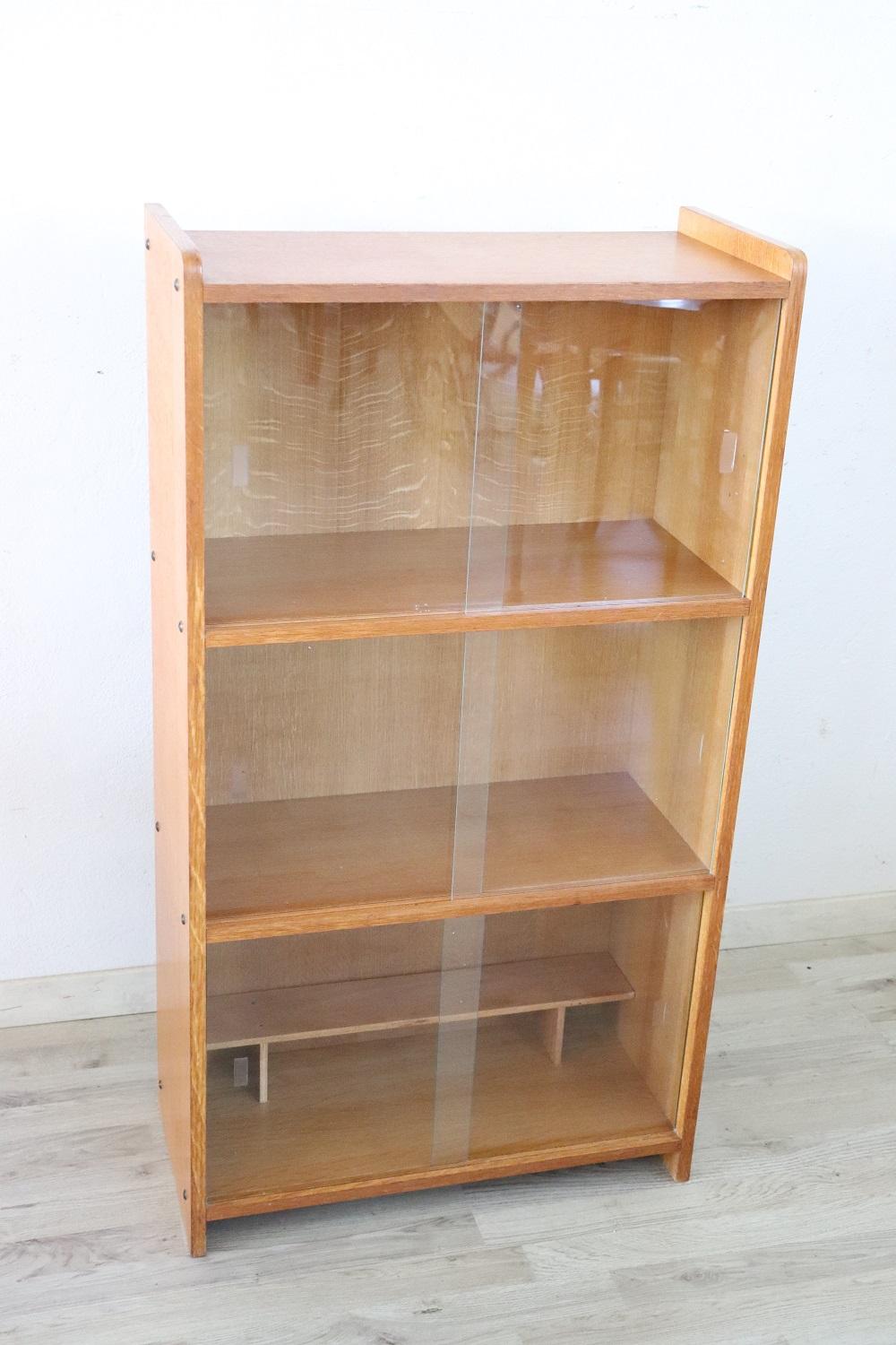 Nice Italian vintage small bookcase or vitrine 1980s. Equipped with two shelves. On the front two sliding glass doors. Perfect conditions.