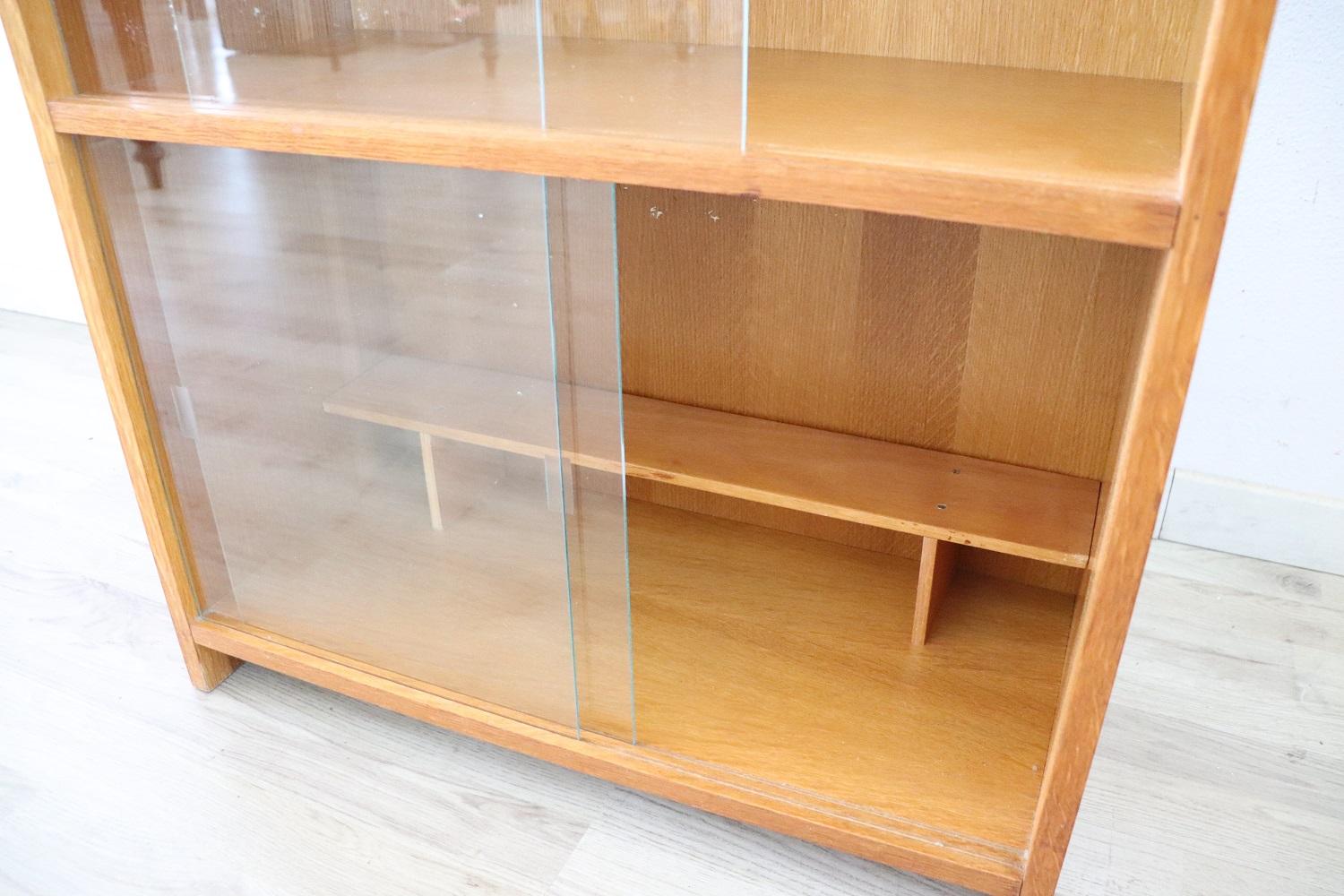 Oak 20th Century Italian Vintage Small Bookcase or Vitrine with Sliding Doors For Sale