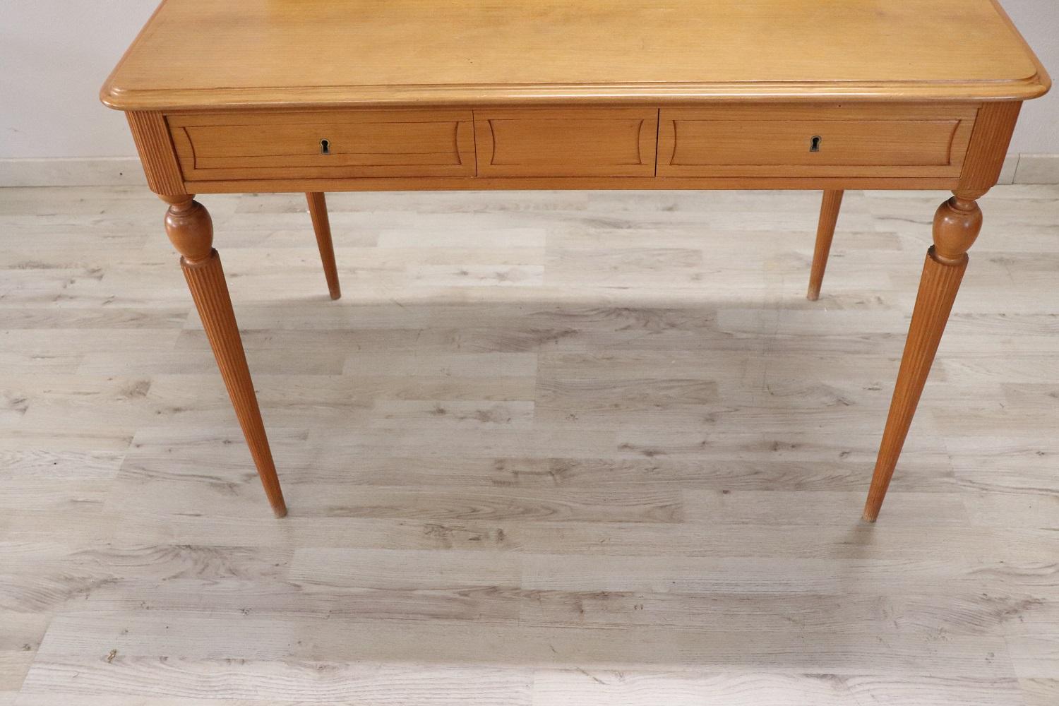 Very refined this vintage Italian desk from the 1960s. Made of very light walnut wood. slender but solid legs. Ample space on the top equipped with two comfortable drawers. Simple and linear, perfect for a modern environment. Perfect condition ready