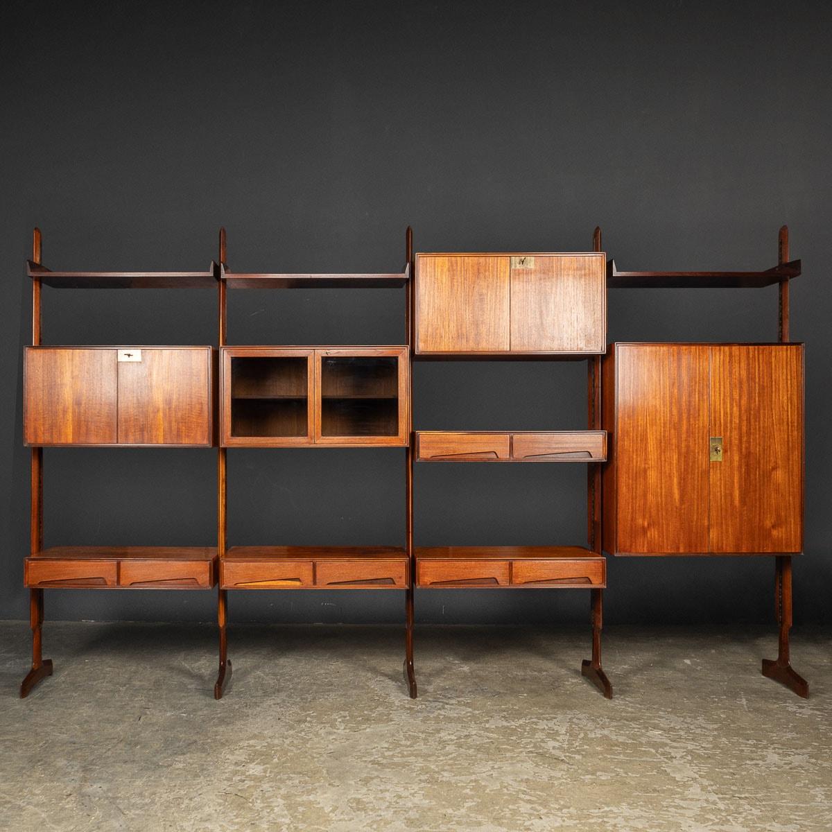 A rare versatile piece of mid 20th Century Italian furniture, this free standing wall unit can also be used as a room divider. Designed by and manufactured by Vittorio Dassi, this classic unit features a range of shelves, drawers and locking