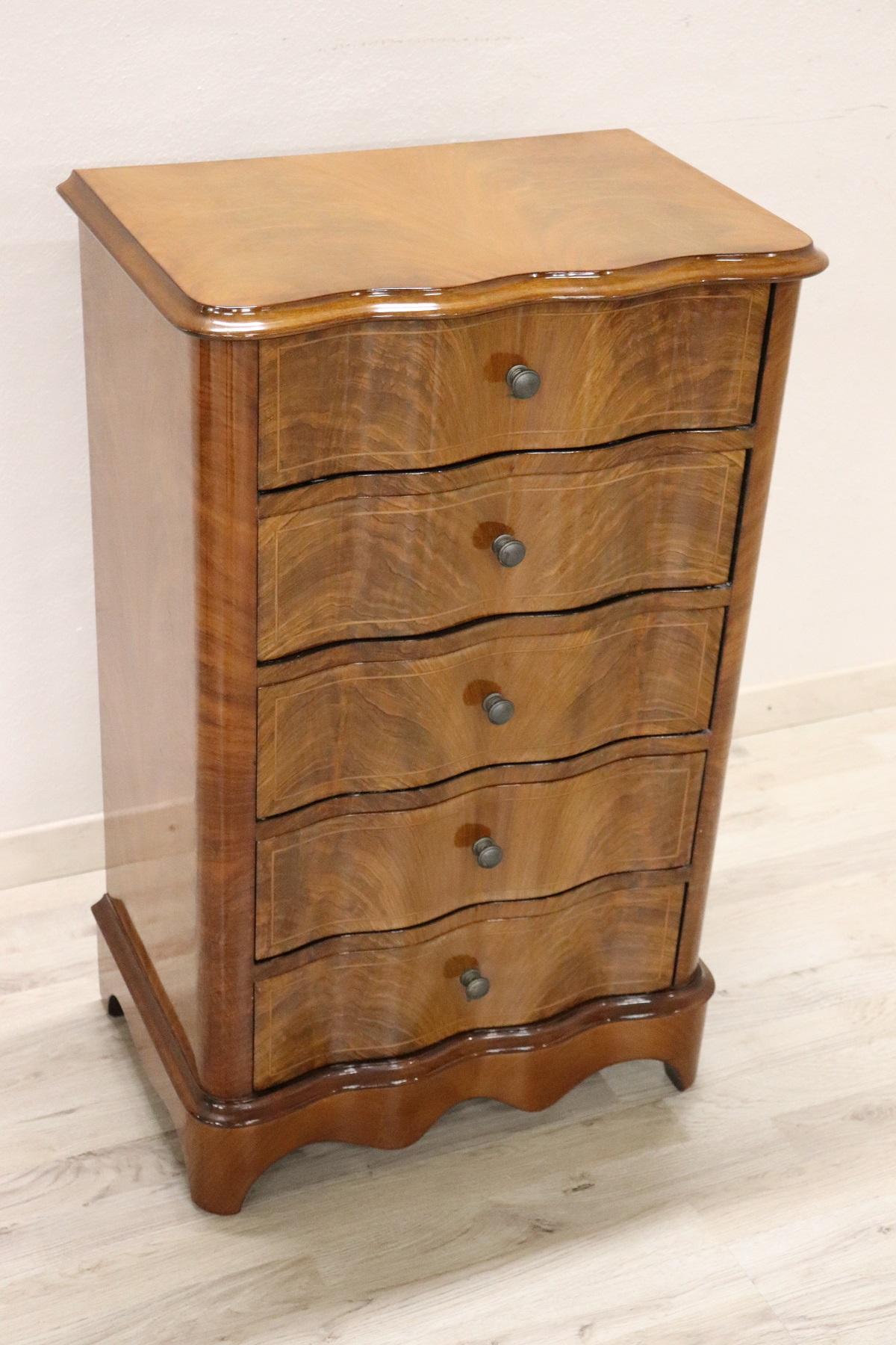 Elegant chest of drawers in walnut wood, 1950s. Lots of useful internal space with five comfortable drawers. Particular shape on the front. Truly elegant and important for any room in the house. You will receive this cabinet in perfect conditions,