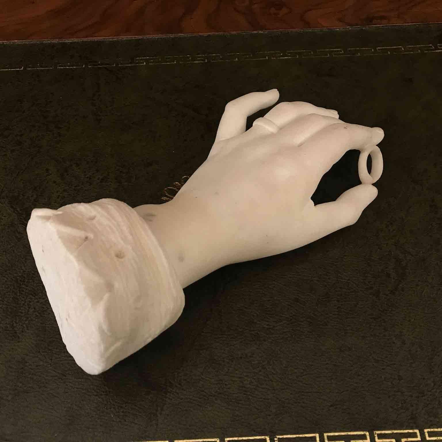 white hand sculpture