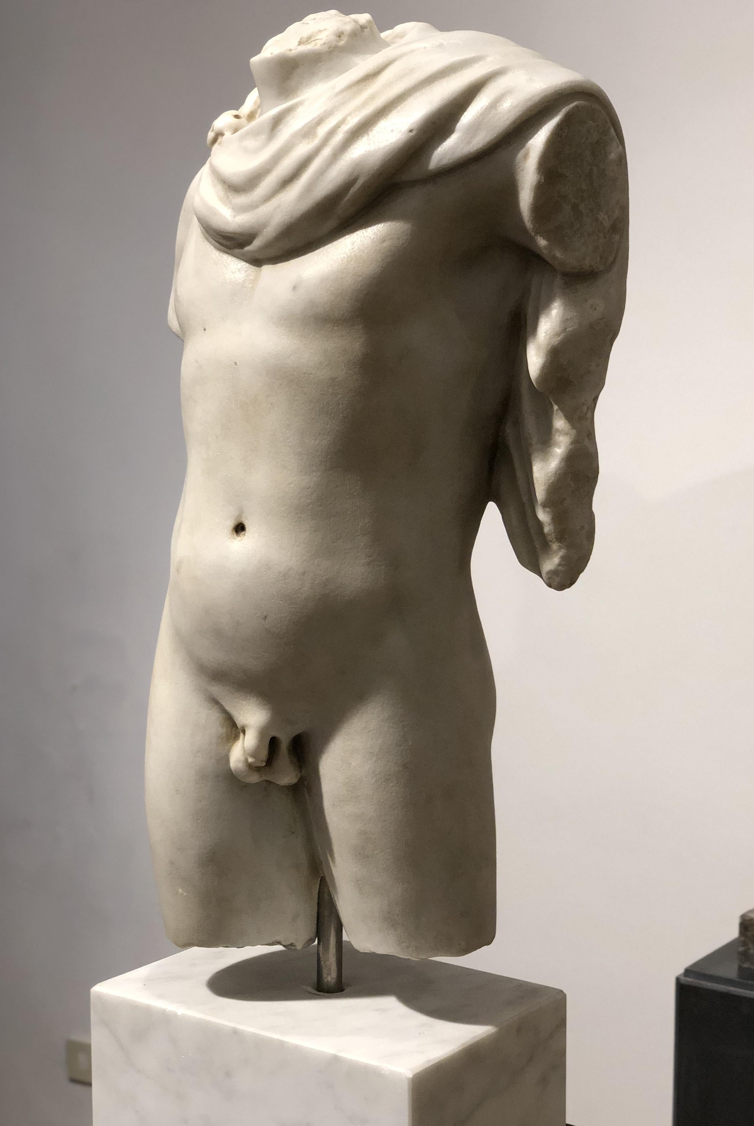 A very nice and elegant white marble sculpture of torso, after the ancient original Greek. Apollo (Attic, Ionic, and is one of the most important and complex of the Olympian deities in classical Greek and Roman religion and Greek and Roman