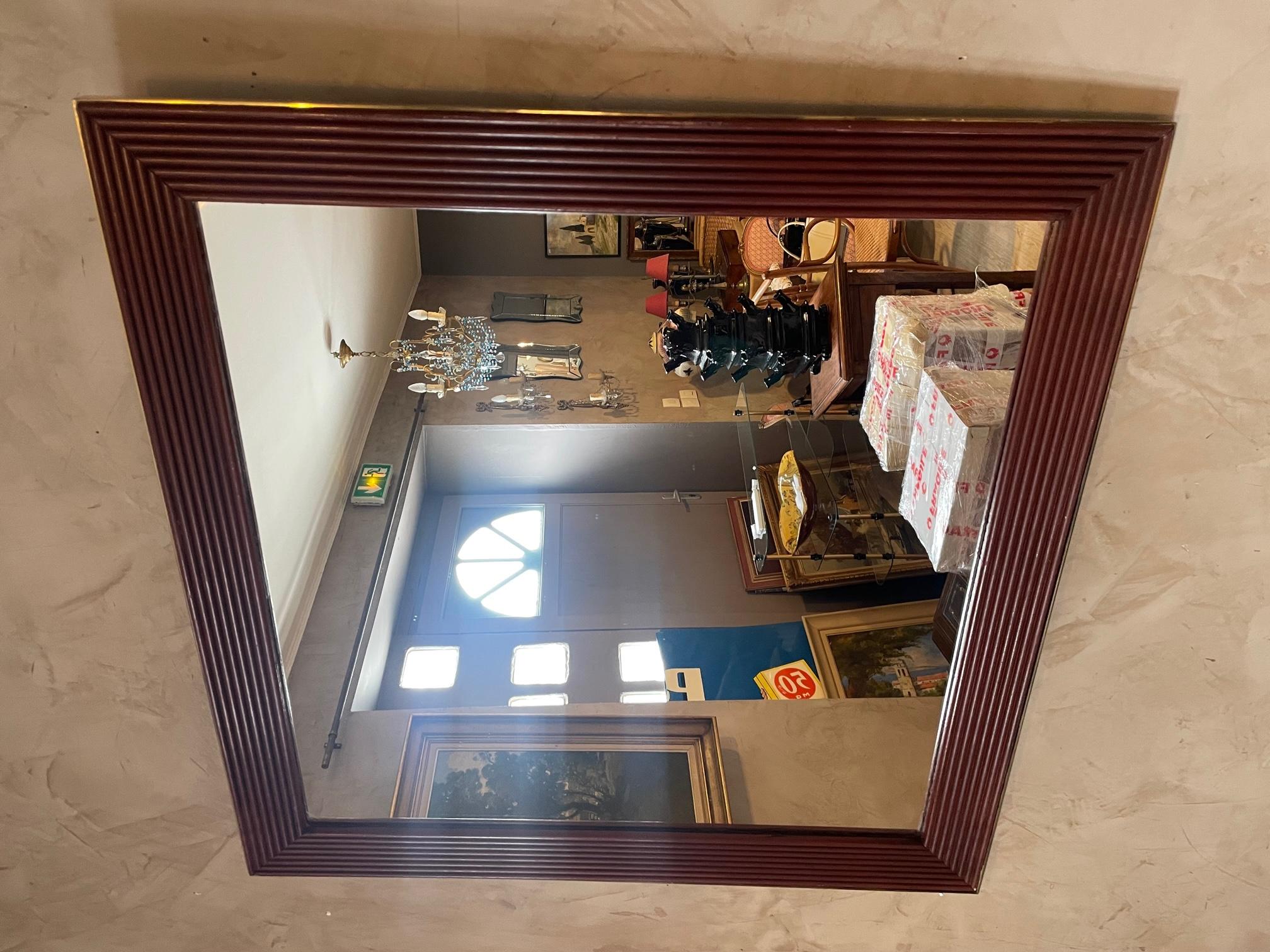 Very nice 20th century wood and brass mirror from the 1970s. 
Good quality and condition. Italian manufacture. 
