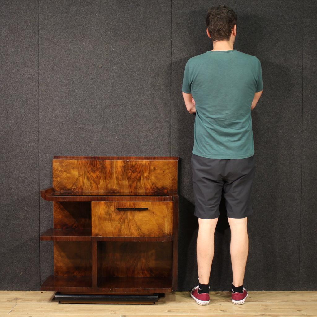 Elegant Italian cabinet from the mid-20th century. Art Deco style cabinet veneered in walnut, palisander, fruitwood and ebonized wood. Sideboard with opaque glass top with some scratches / signs of wear. Small bookcase complete with 3 open