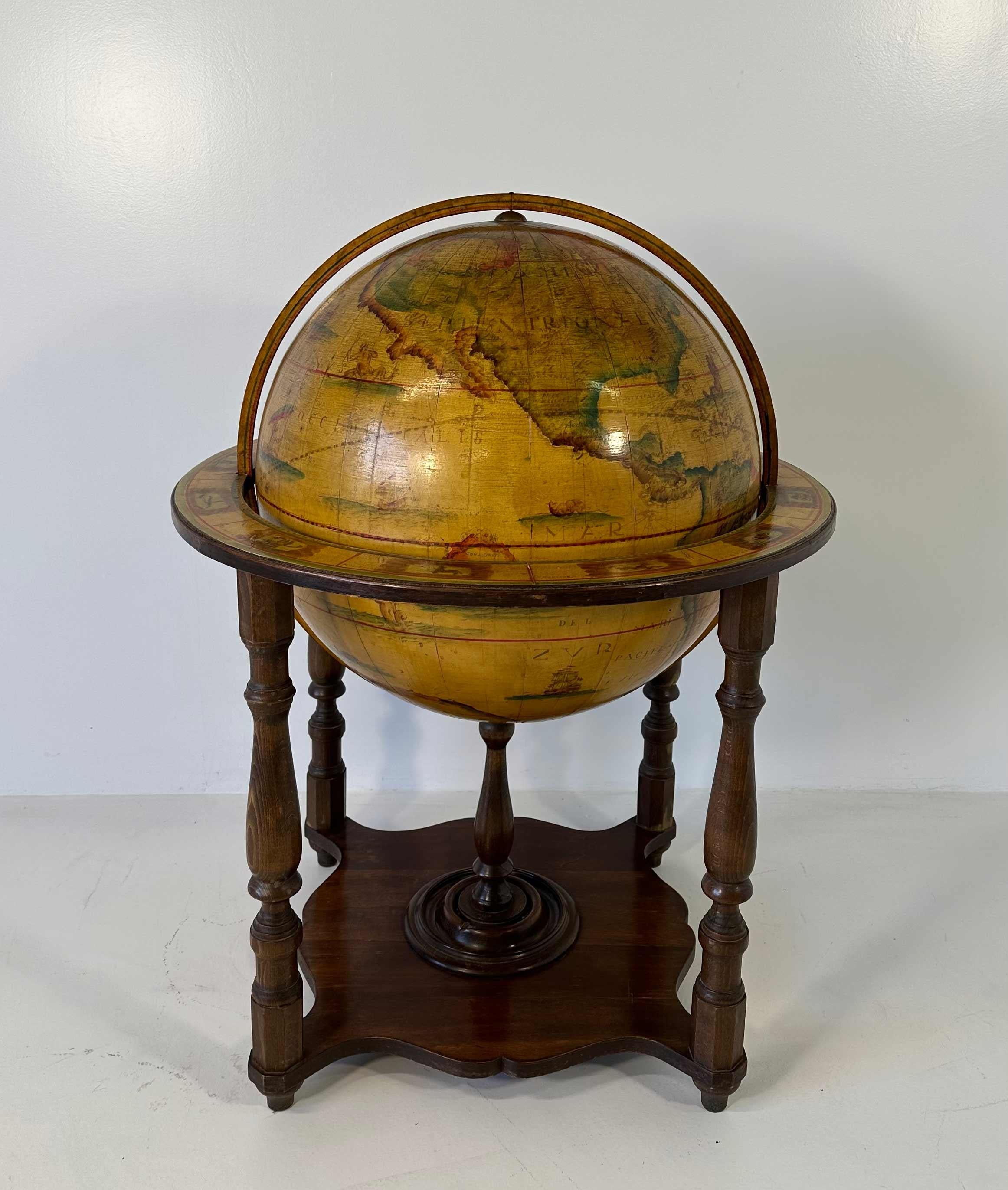 This wood globe was produced in Italy in the 1970s. 
It is completely made of wood and covered with antique style paper depicting, indeed a map of the world. 
In very good vintage conditions.