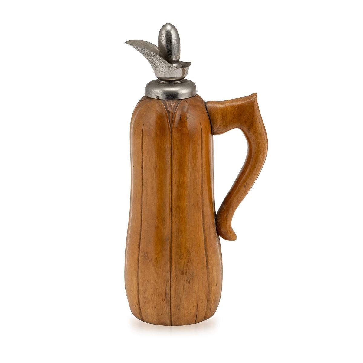 An Aldo Tura wood flask crafted for Macabo, Cusano Milanino, made in Italy around the 1960s. This exquisite piece reflects the distinctive style of Aldo Tura, a renowned Italian designer known for his innovative and luxurious creations. The carved