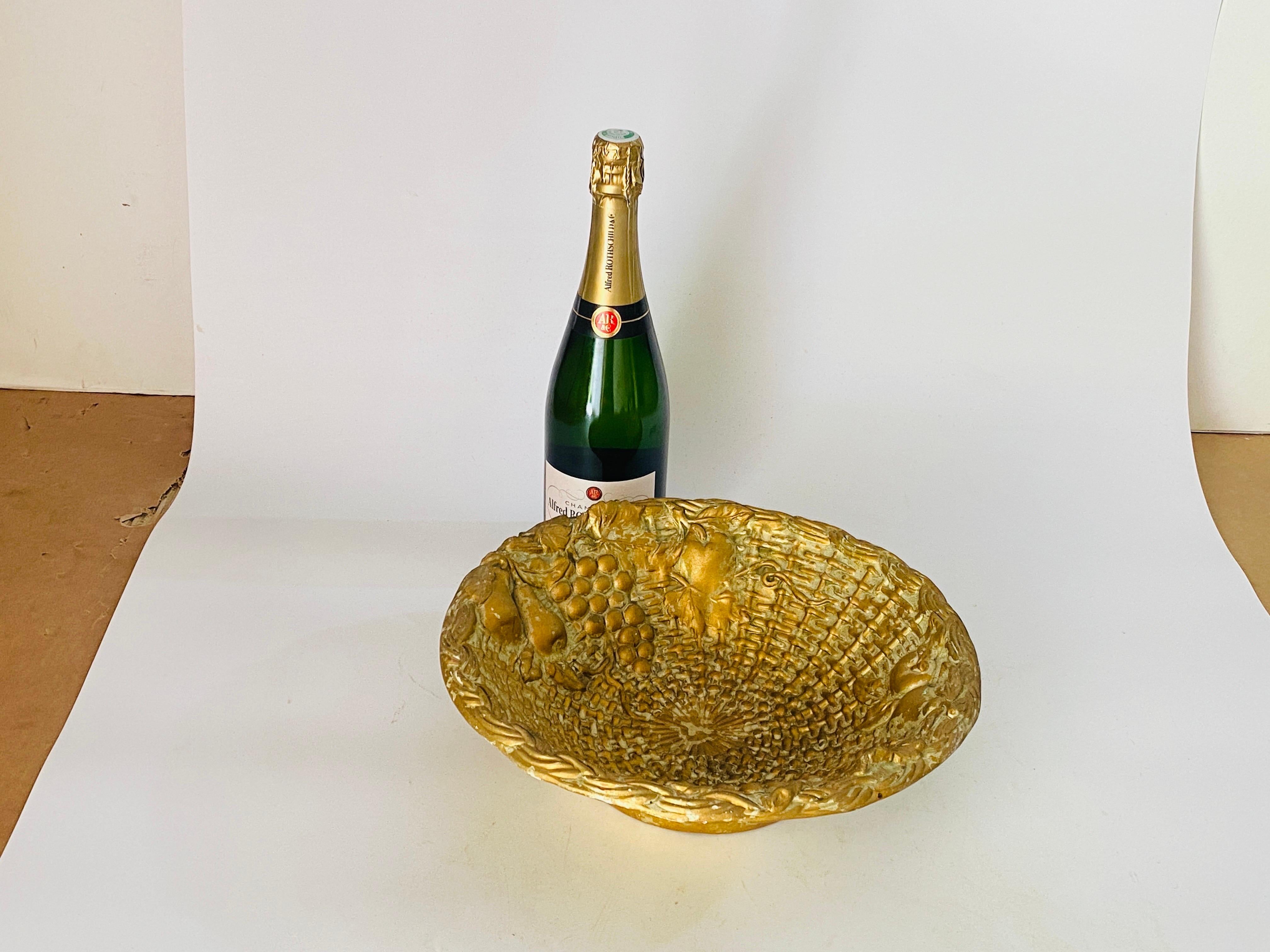 Bowl in Gilt Plaster with fruits pattern design.
20th century
Italy.