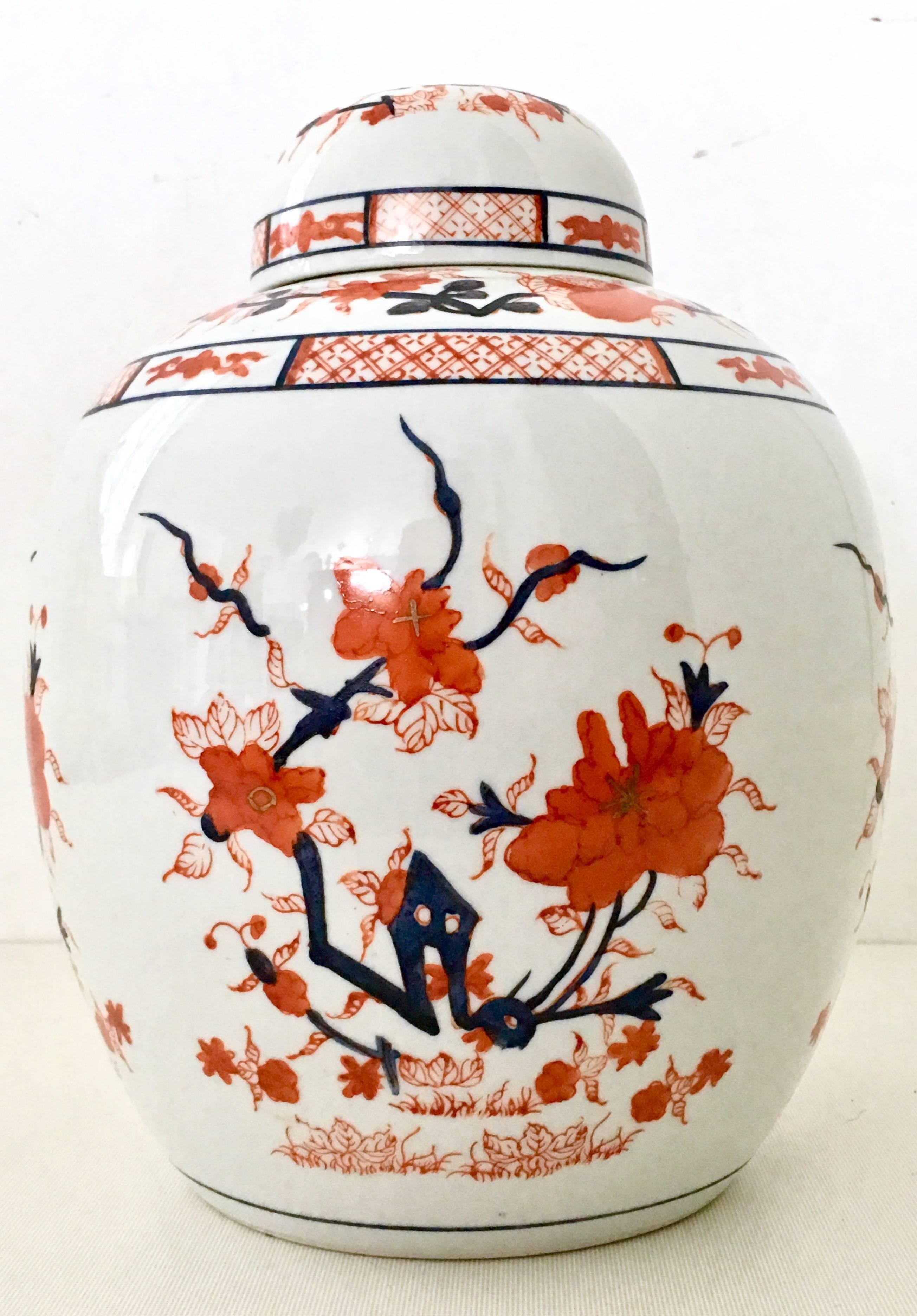 1970s Japanese Imari hand-painted lidded ginger jar-signed. This Classic Imari hand-painted with 22-karat gold accent is signed on the underside, decorated in Hong Kong.
  