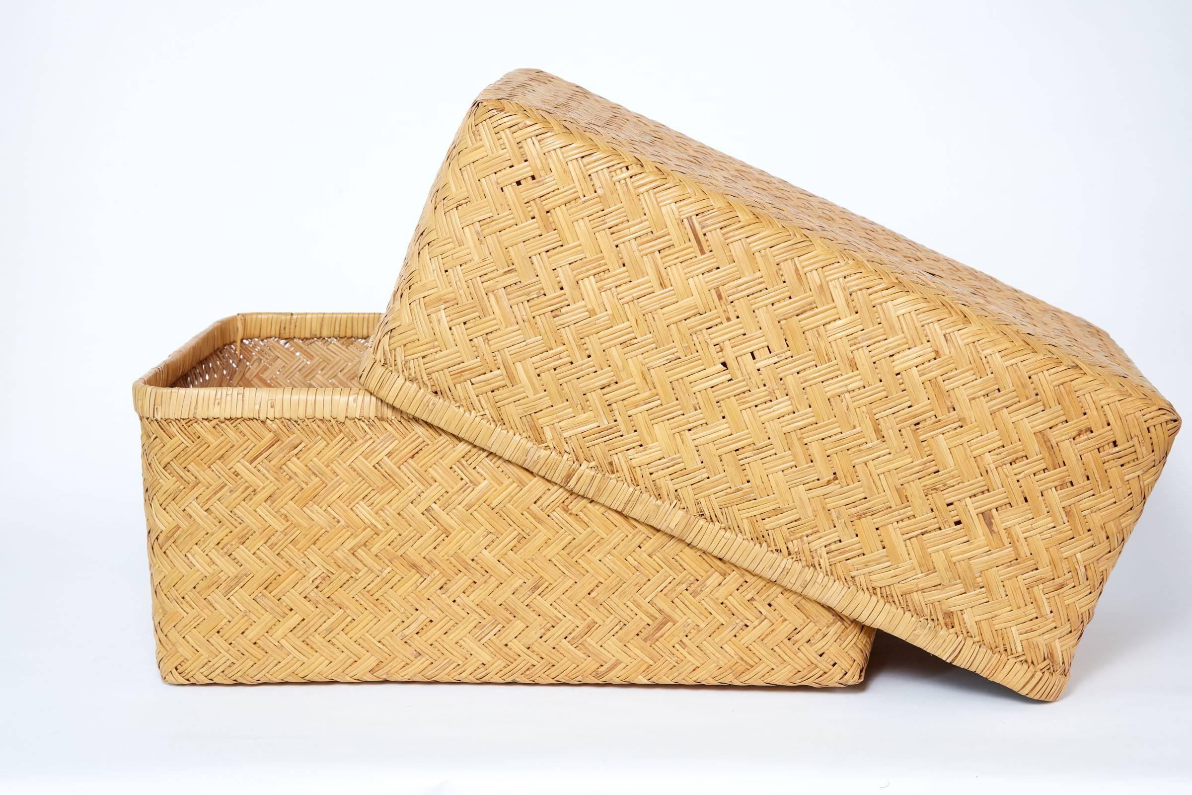 20th century Kidded Japanese Kimono basket. Two pieces 
Large basket is lid 22.5 in. W x 14.75 in. D x 9 in. H
Smaller basket is bottom 21.5 in. W x 13.5 in. D x 9 in. H.