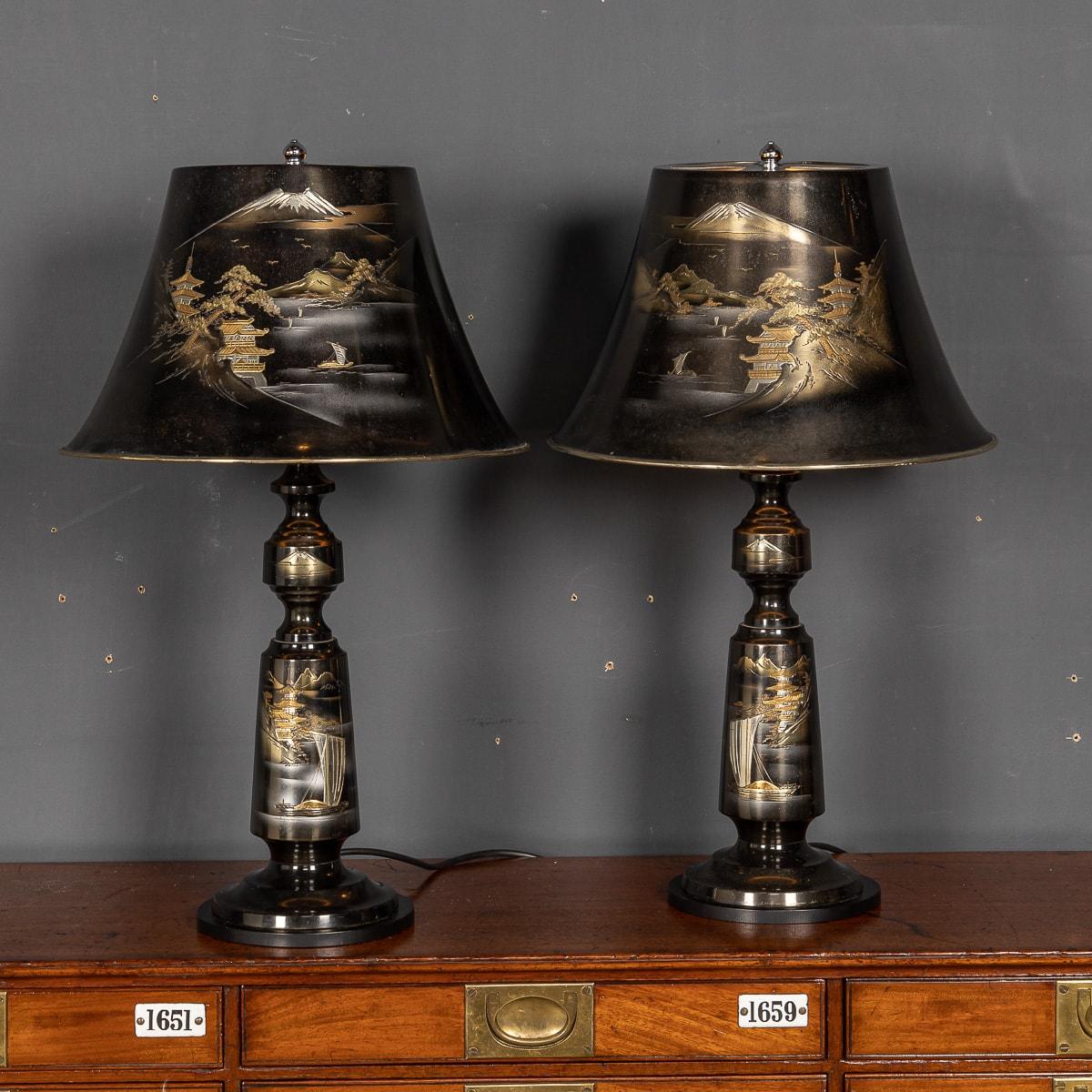 A stunning pair of mid 20th Century Japanese table lamps in a traditional black lacquered finish with a delicate depiction of Mount Fuji in gold and silver.

CONDITION
In Great Condition - No Damage.

SIZE
Shade diameter: 35.5cm
Shade Height: