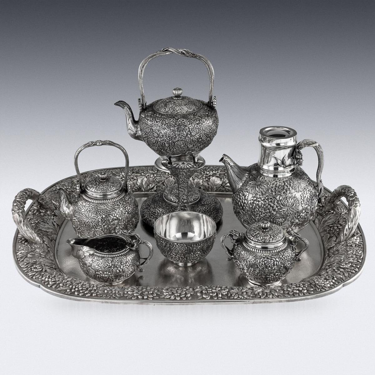 Antique early 20th century Japanese Meiji period, solid silver large seven-piece tea and coffee service on tray, comprising: a teapot, a coffee pot, a kettle on stand, a cream jug, a covered sugar bowl, a waste bowl, a covered entree dish on stand,