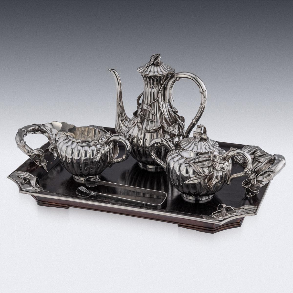 Antique early-20th Century Japanese Meiji period, solid silver coffee set with sugar tongs on wood serving tray, exceptional and magnificent quality, applied with bamboo leaves and bamboo c-form handles, on bolbous plain ground. Hallmarked with the