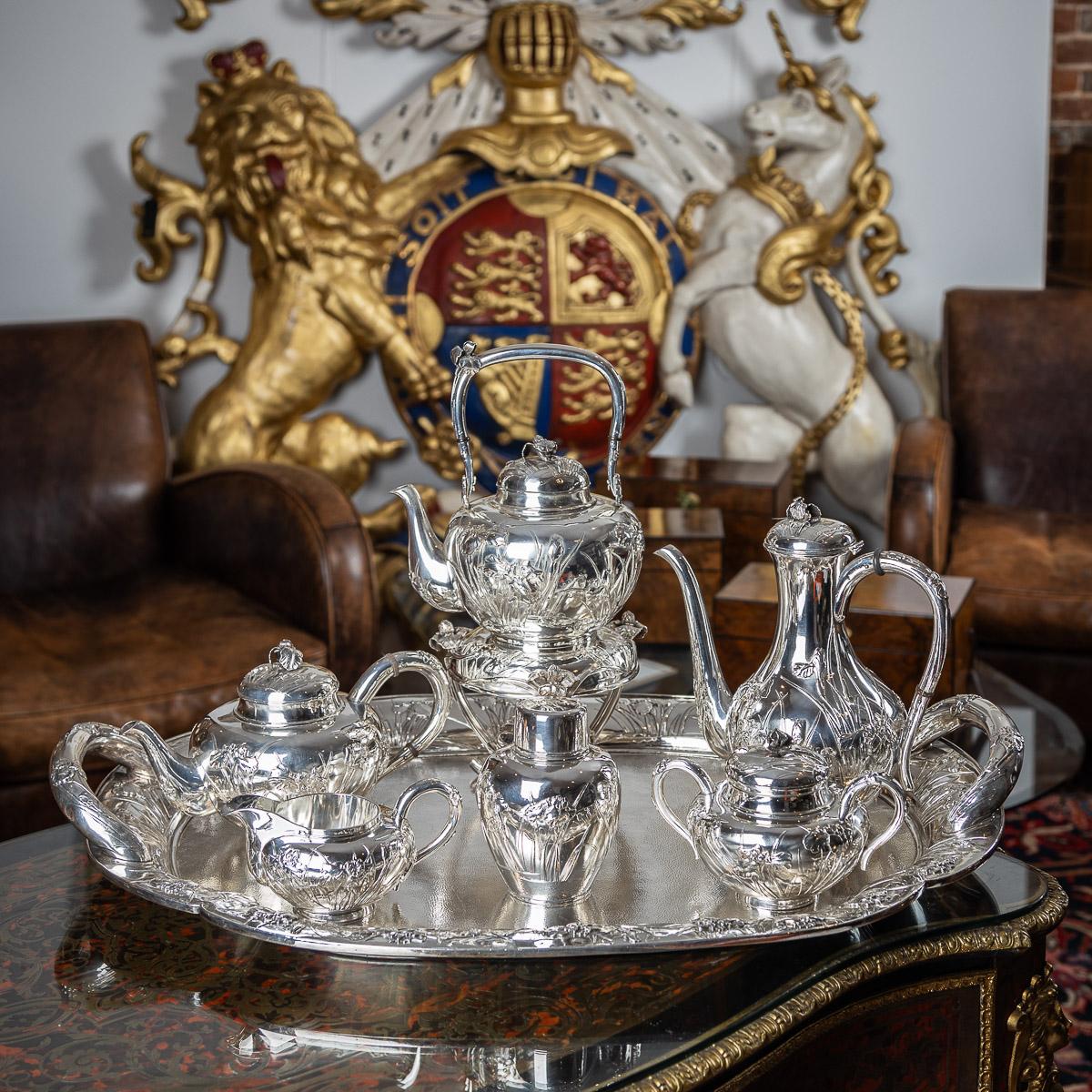 Antique stunning and exceptional early-20th Century Japanese solid silver siz piece tea and coffee service, comprising a coffee pot, teapot, kettle on stand, tea caddy, waist bowl, sugar bowl, cream jug and tray. This magnificent set boasts