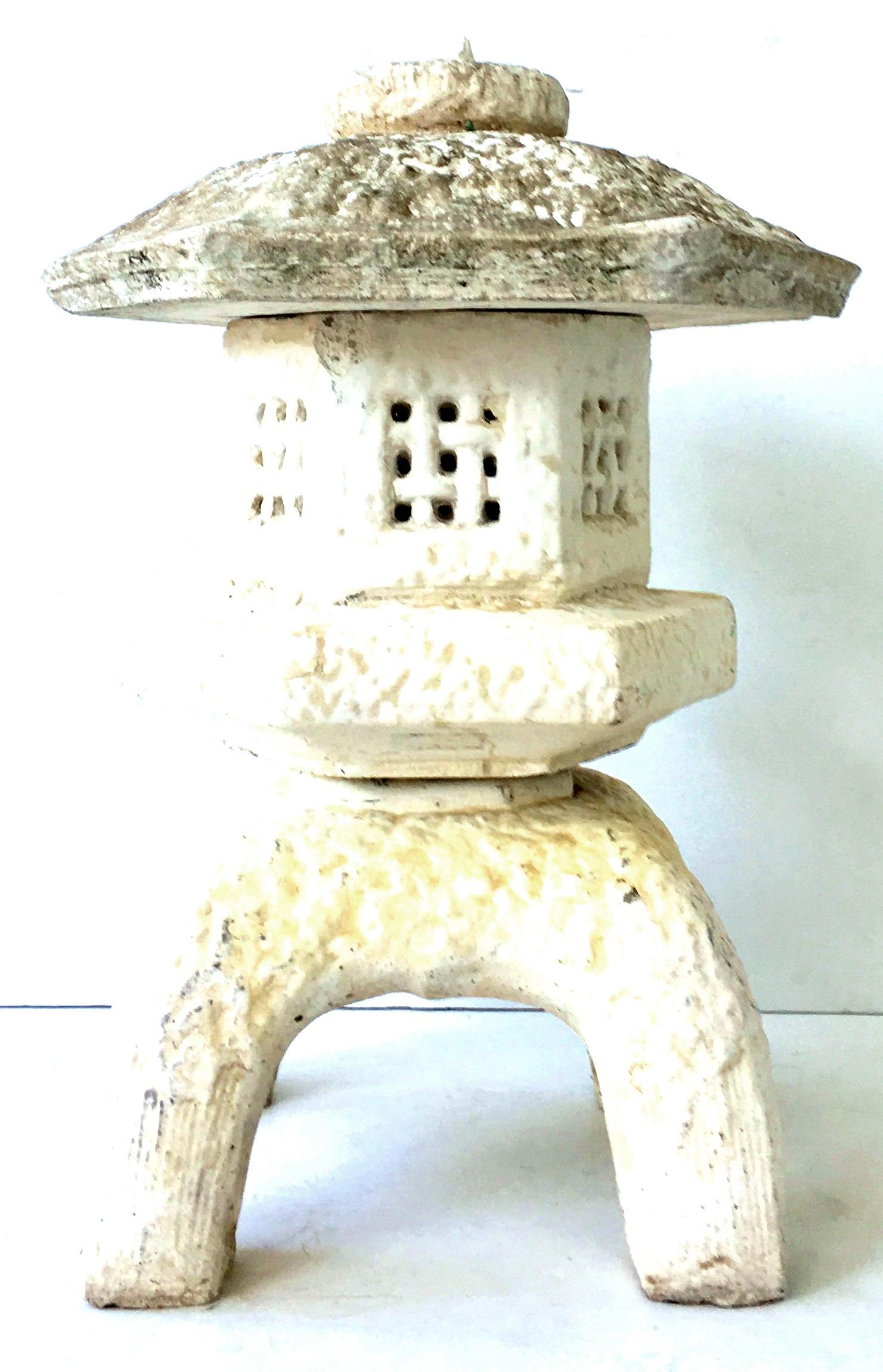 Mid-Century Japanese Style three-piece cast stone pagoda lantern sculpture.
This coveted patina aged garden sculpture is three pieces, the base, the body and lid. Appropriate wear and patina for age and use.