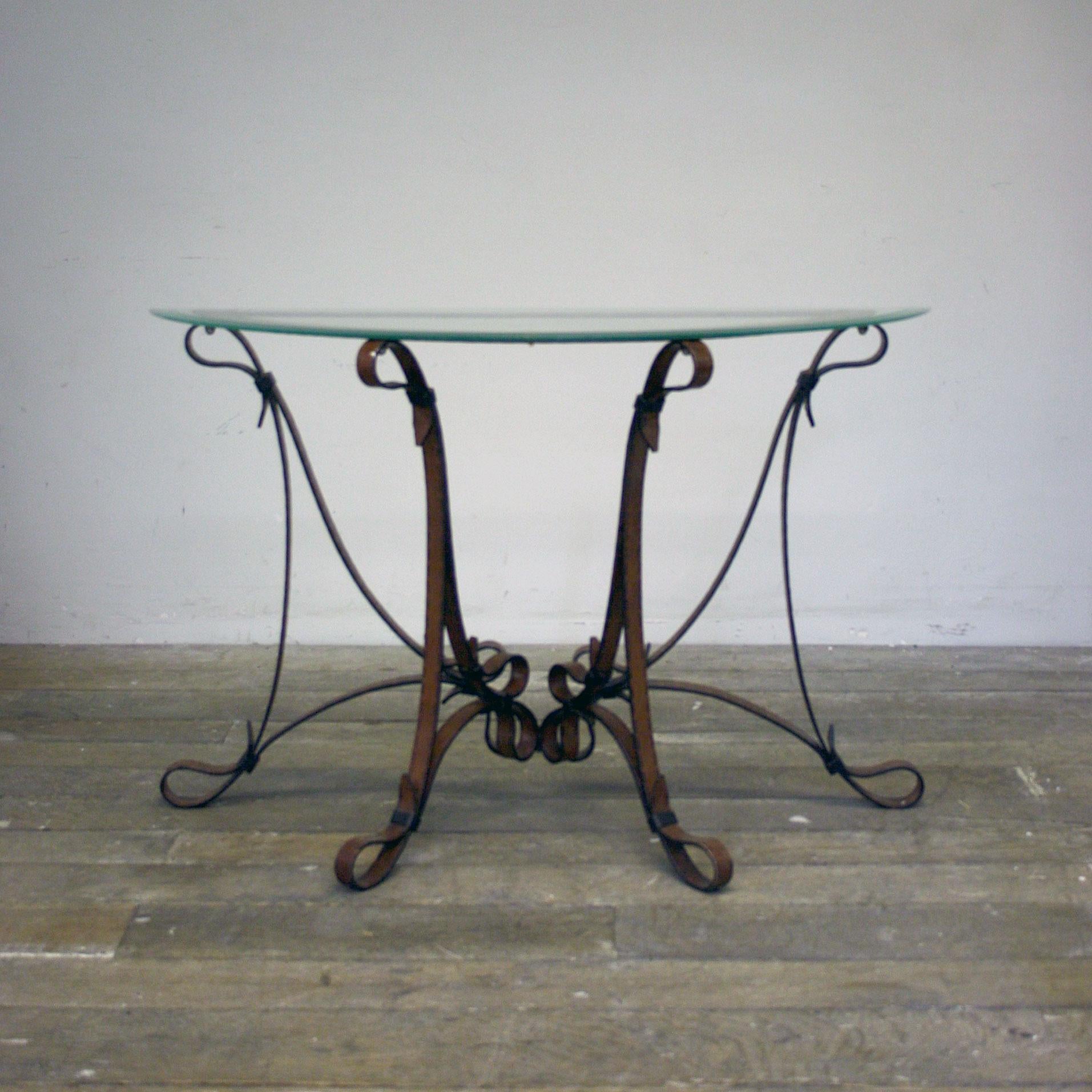 This amazing late 20th century Faux leather metal demi lame console table with glass top has all the signature details as per Hermes and Jacques Adnet, Equestrian leather straps, rings and buckles, all giving the appearance of horse reins, the