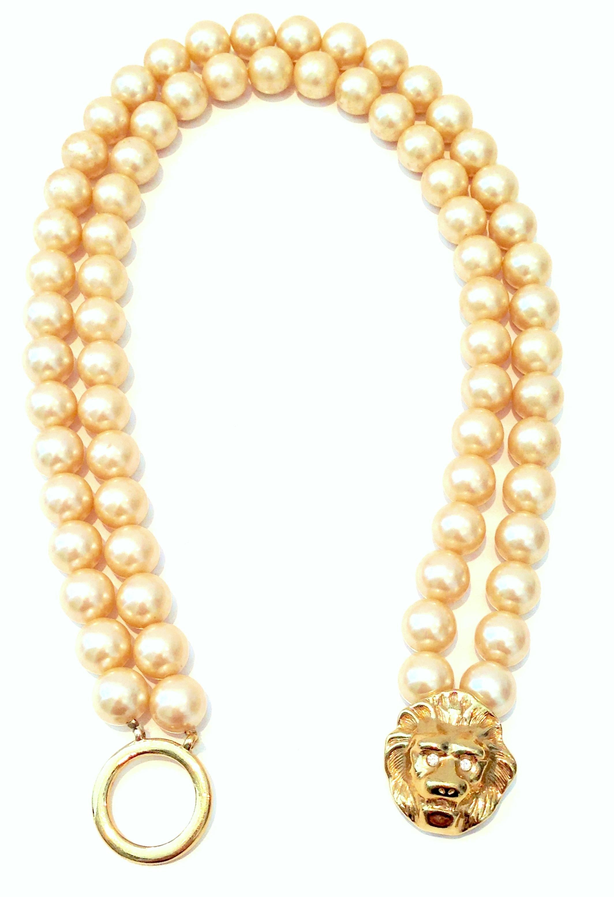 20th Century Kenneth Jay Lane Double Strand Faux Pearl, Austrian Crystal & Gold Lion Head Choker style Necklace. Features a double strand of faux off white faux pearl beads and a Gold plate with colorless brilliant cut and faceted Austrian Crystal