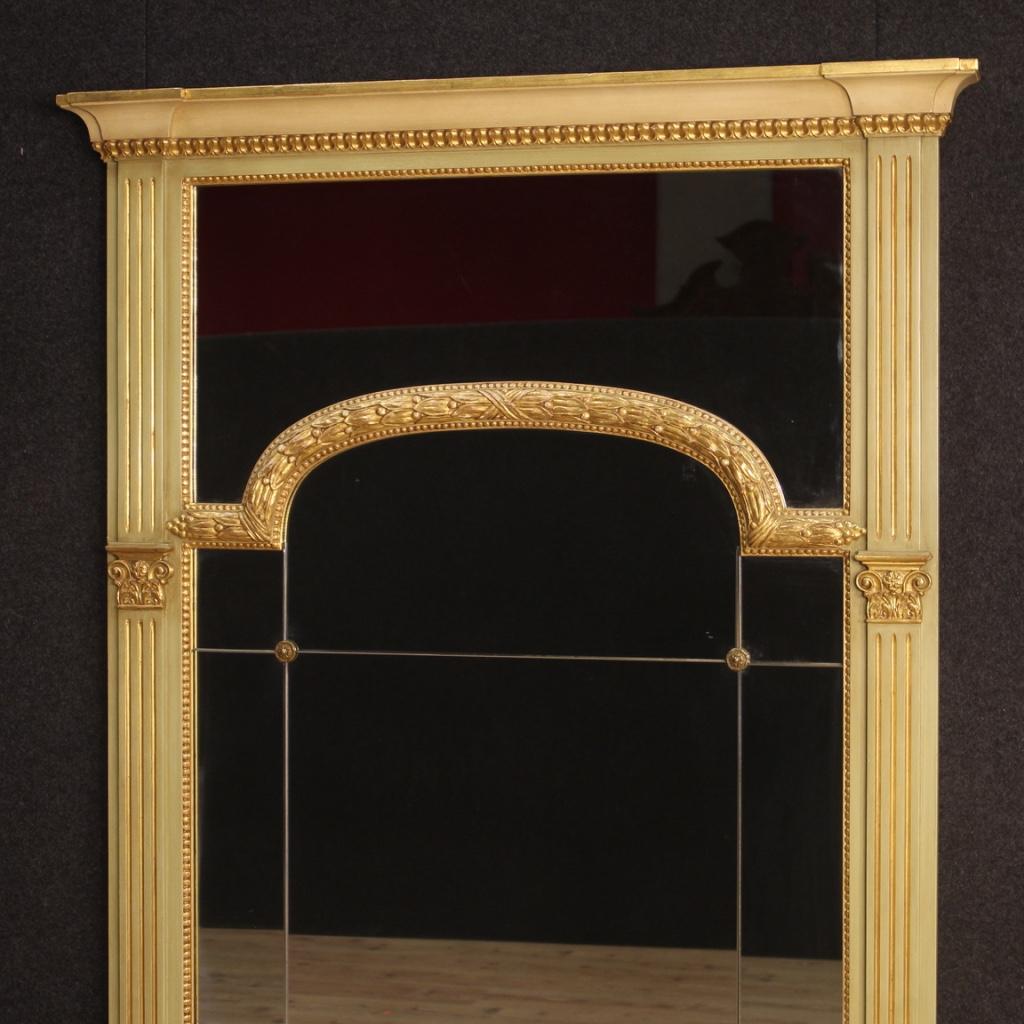 Great Italian mirror from the 20th century. Furniture in carved, lacquered and gilded wood in Louis XVI style of beautiful line and pleasant decor. Firemantel mirror of excellent proportions ideal to combine with a fireplace, dresser or bureau.