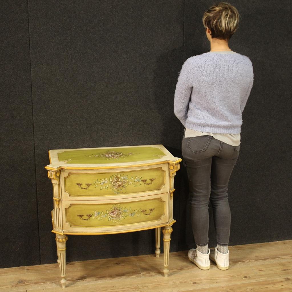 Small Tuscan dresser from the 20th century. Furniture in lacquered and painted wood with very pleasant floral decorations. Chest of drawers equipped with two drawers of good capacity and upper wooden top in character of good size and service.