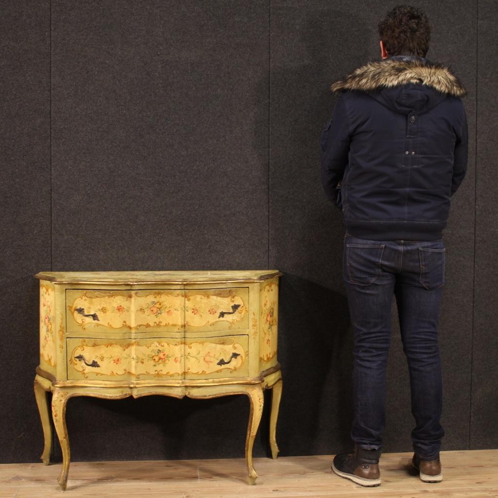 Venetian commode from the mid-20th century. Furniture in lacquered, gilded and hand painted wood with very pleasant floral decorations. Commode with high leg, for bedroom or living room, equipped with two front drawers of good capacity. Moved and