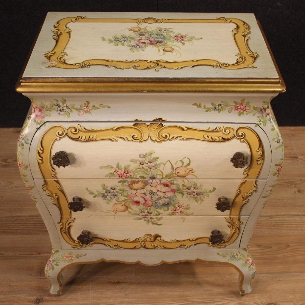 Italian dresser from the second half of the 20th century. Furniture richly lacquered and painted with very pleasant floral decorations. Chest of drawers with three front drawers of good capacity with wooden top in character. Furniture of excellent