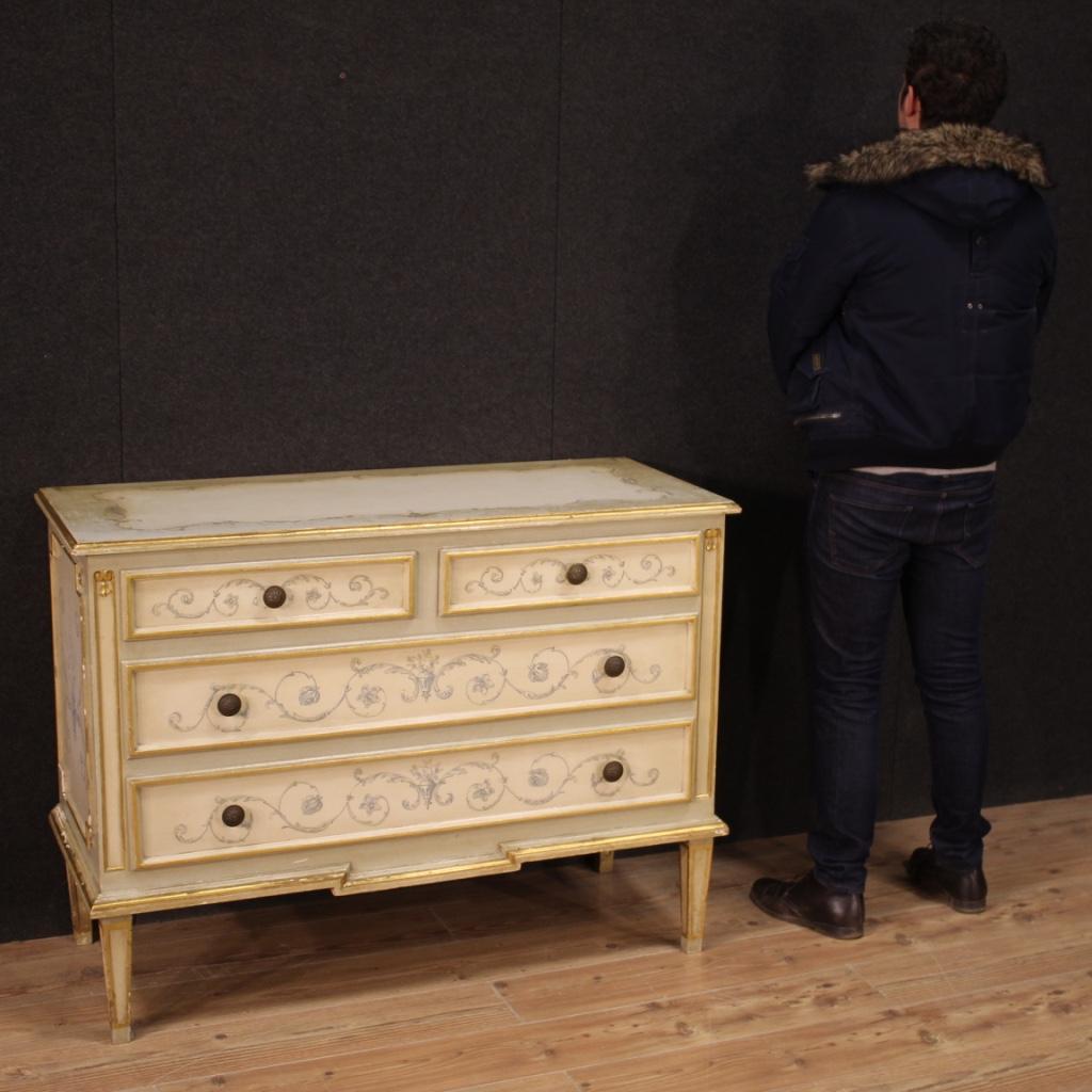 Italian dresser from the 20th century. Lacquered, gilded and hand-painted wooden furniture with Louis XVI style decorations of beautiful line and pleasant decor. Chest of drawers equipped with two smaller parallel drawers under the top and two