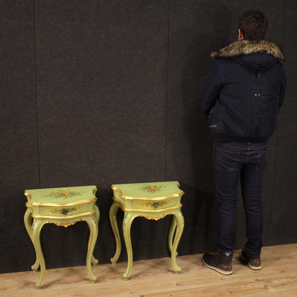 Pair of Venetian bedside tables from the mid-20th century. Furniture in lacquered, gilded and hand painted wood with very pleasant floral decorations. Bedside tables for bedroom or living room, equipped with a front drawer and wooden top lacquered