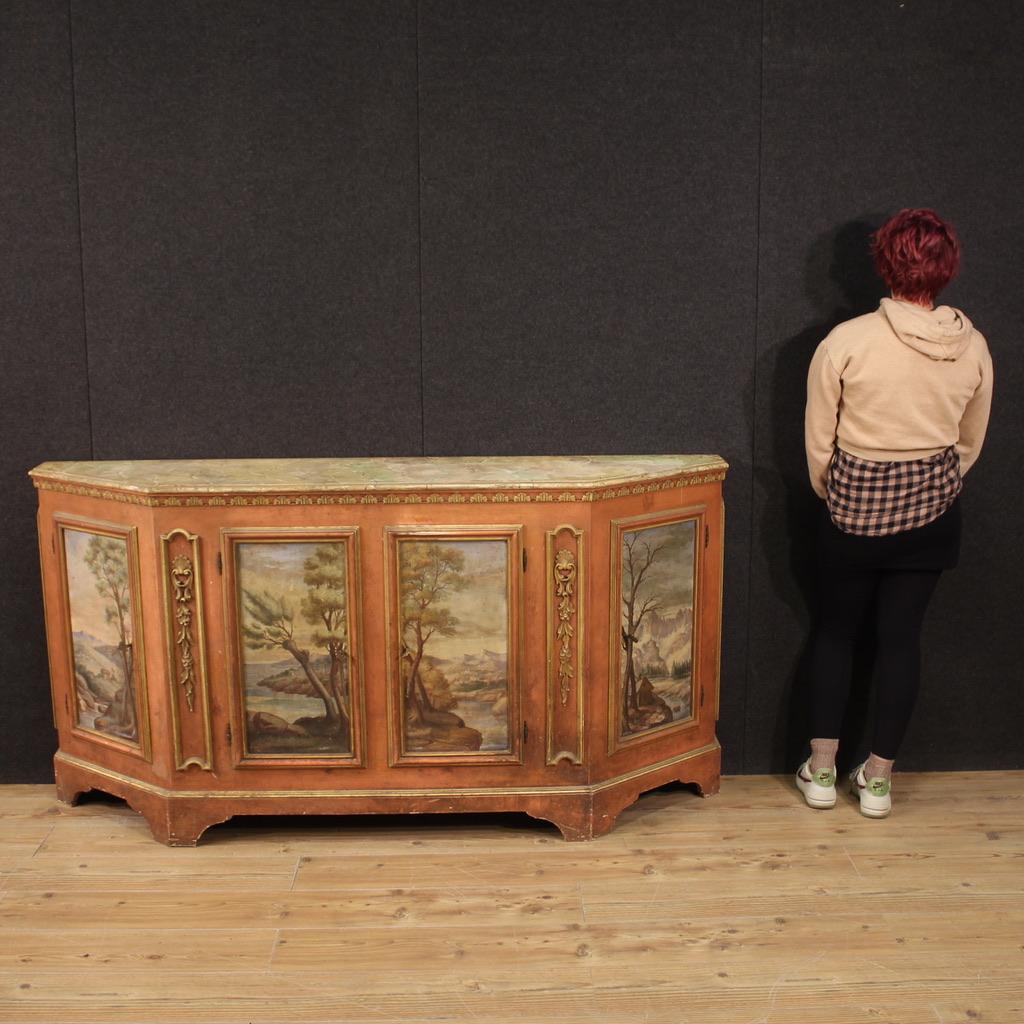 Venetian sideboard from the mid-20th century. High quality furniture in carved, lacquered and hand painted wood with eighteenth-century style landscapes. Sideboard with 4 doors, complete with 4 working keys, of excellent capacity and service. Very