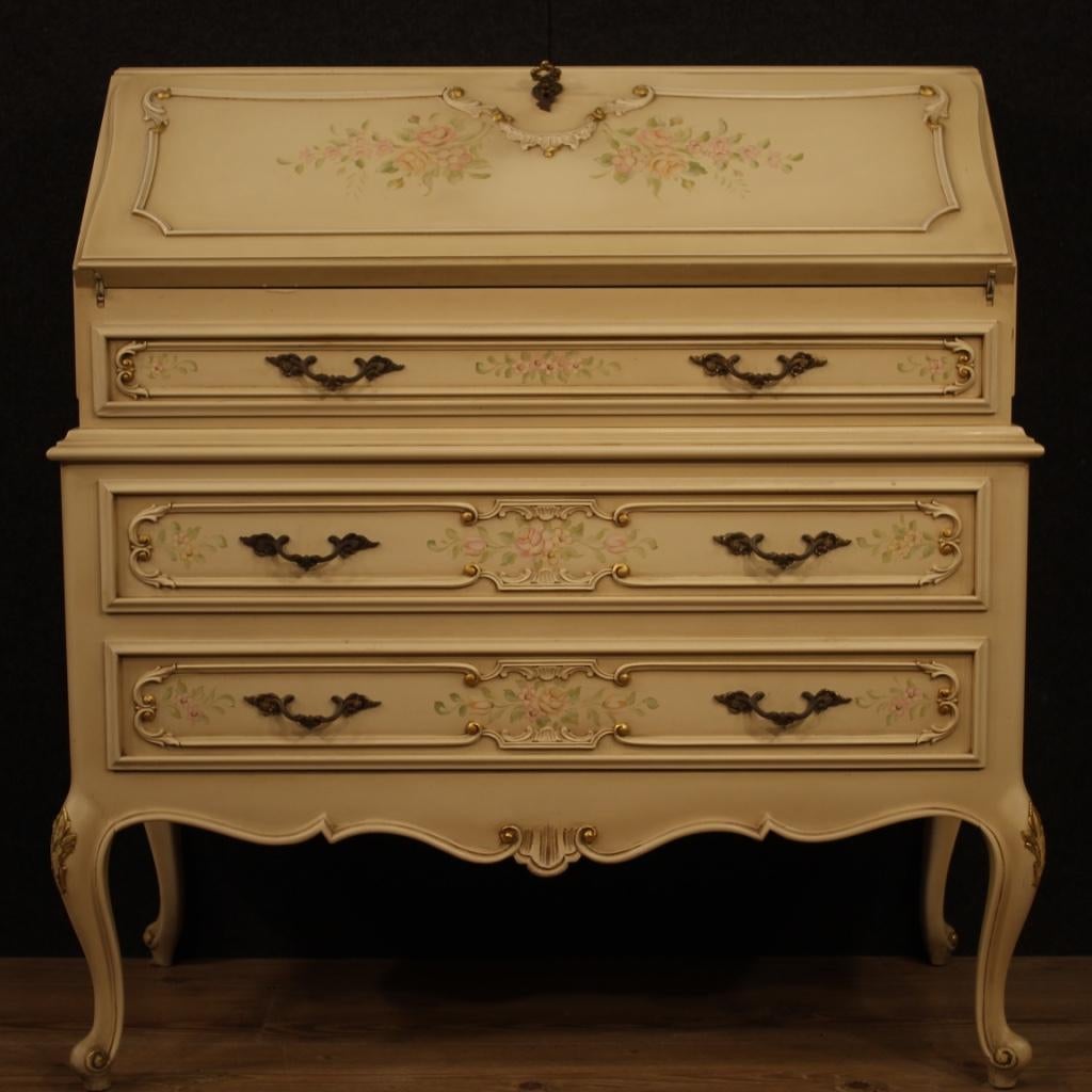 Italian bureau from 20th century. Furniture in carved, lacquered, gilded and hand painted wood with very pleasant floral decorations. Bureau with three external drawers of good capacity and fall-front. Interior also lacquered complete with two