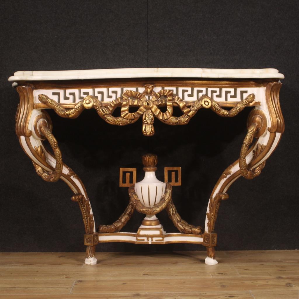 French console from the second half of the 20th century. Furniture in wood and plaster in the Louis XV style, carved, lacquered and gilded (bronze tint) of beautiful line and pleasant decor. Top in original marble, of considerable weight, of great