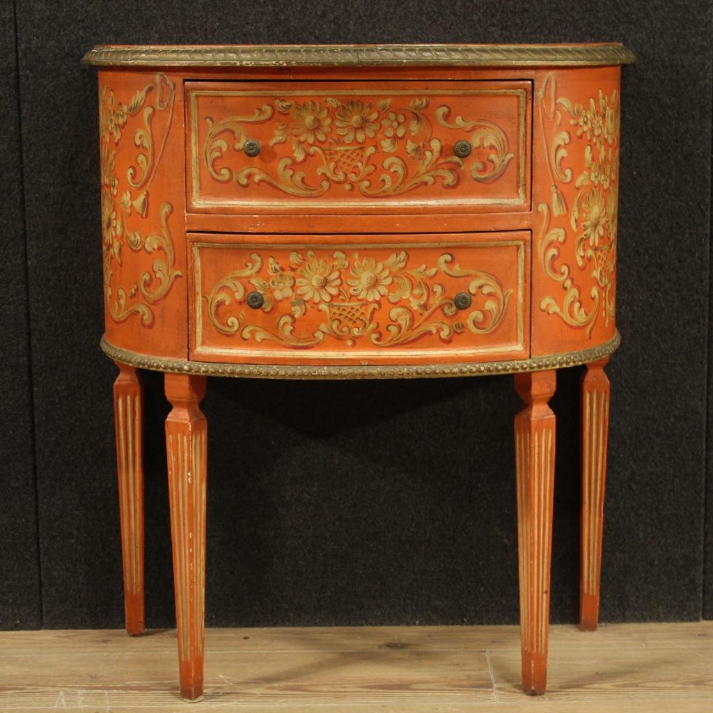 Graceful 20th century Italian dresser. Furniture in lacquered, gilded (bronze tinted) and painted wood in Louis XVI style. Small commode supported by four fluted legs in an inverted truncated pyramid shape. Furniture equipped with two front drawers