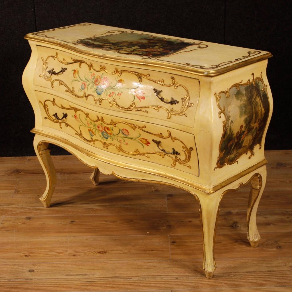 Small Venetian dresser of the 20th century. Furniture pleasantly lacquered, gilded and painted with floral decorations. Chest of drawers with two drawers of reasonable capacity with a wooden top in character. Top and sides adorned with colorful