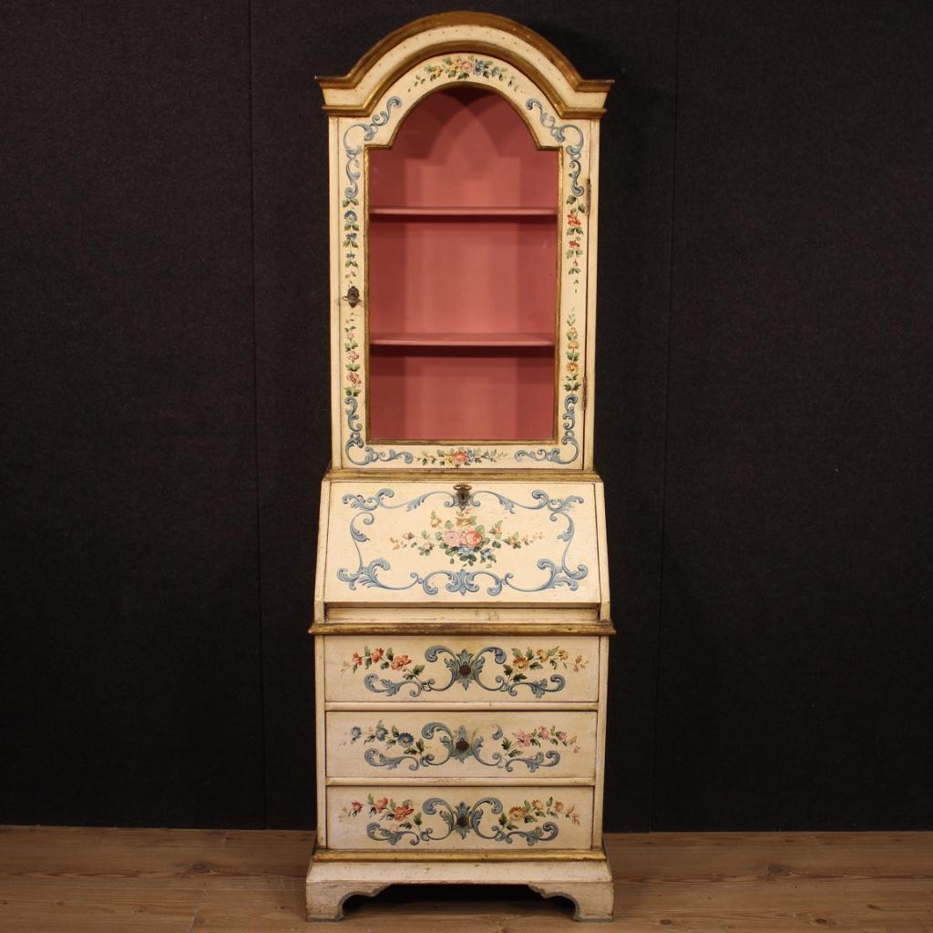 Venetian trumeau from 20th century. Furniture in carved, lacquered, gilded and hand painted wood with very pleasant floral decorations. Double body trumeau equipped with three drawers and fall-front at the bottom. Upper body with one door with