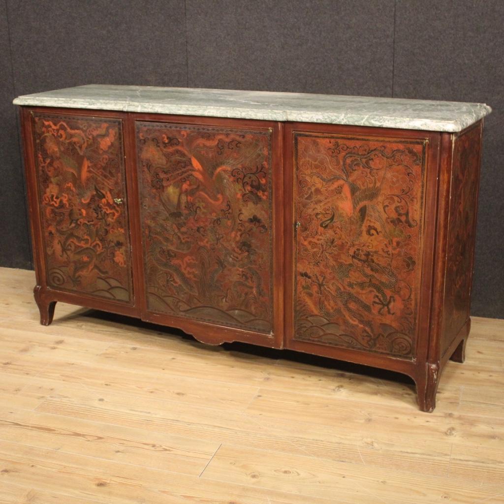 French sideboard from the mid-20th century. Furniture in lacquered and painted chinoiserie wood of great quality, size and impact. Sideboard with three doors of excellent capacity complete with five internal shelves that can be positioned at various