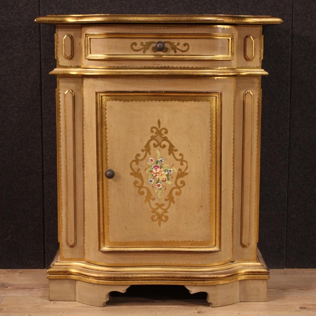Tuscan sideboard of the 20th century. Furniture in lacquered, gilded and hand painted wood with very pleasant floral decorations. Sideboard with one door and one front drawer of good capacity and service. Interior complete with a flatter support