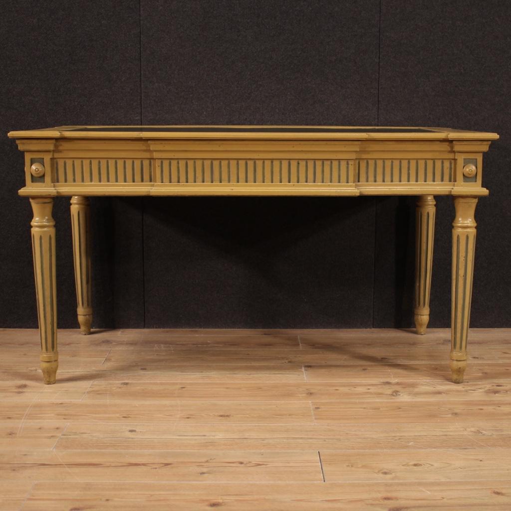 Large Italian writing desk from the mid-20th century. Furniture in carved and lacquered wood in Louis XVI style of beautiful lines and pleasant decor. Desk of great size and impact supported by four solid fluted legs (see photo). Furniture finished